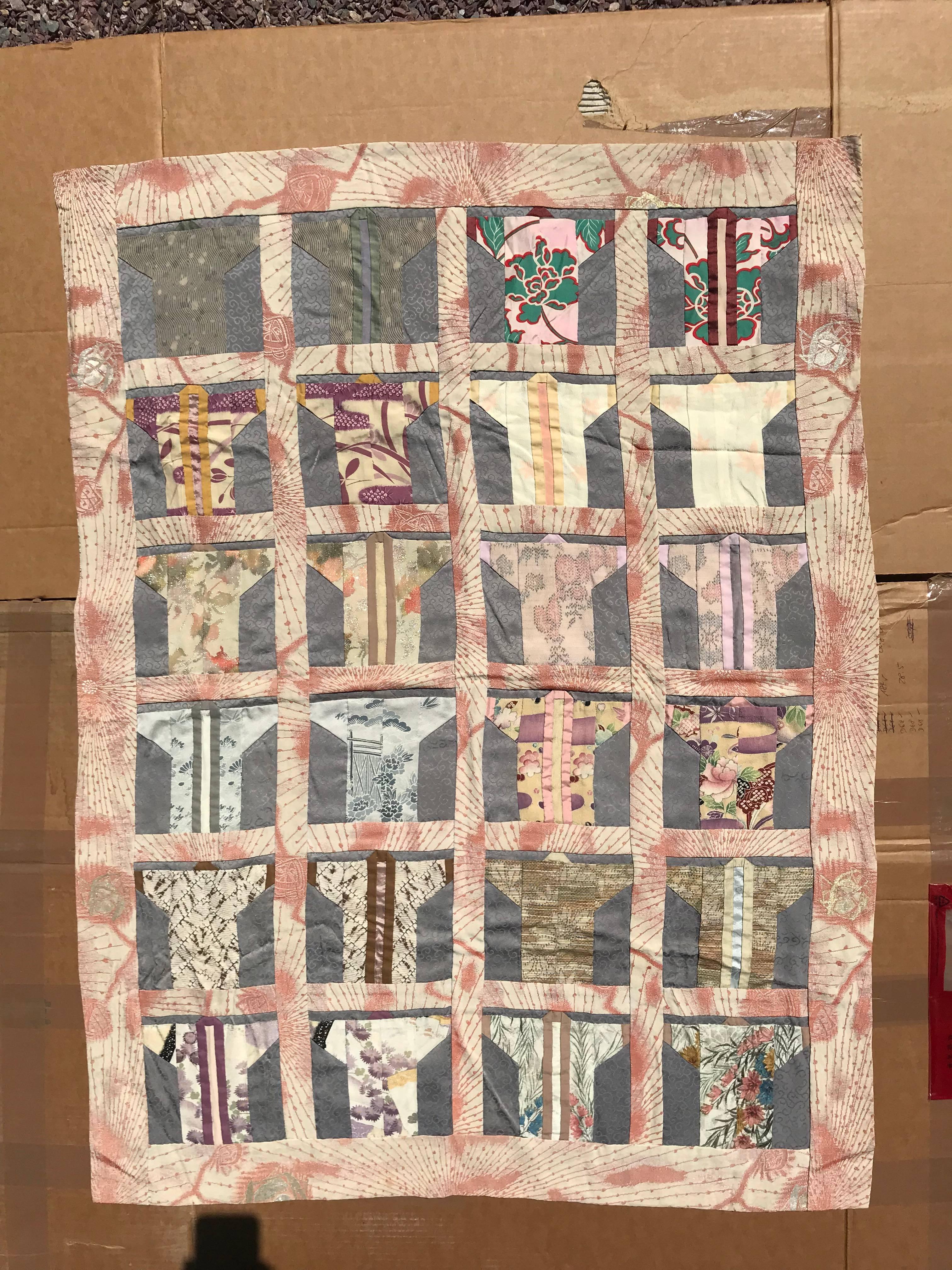 An exceptionally fine quality Japanese hand sewn small fabric quilt wall art crafted from 19th-20th century Kimono fabric in the form of miniature kimono.

Pretty pastels.

It is immediately and eminently frameable if you so desire. 

This is an