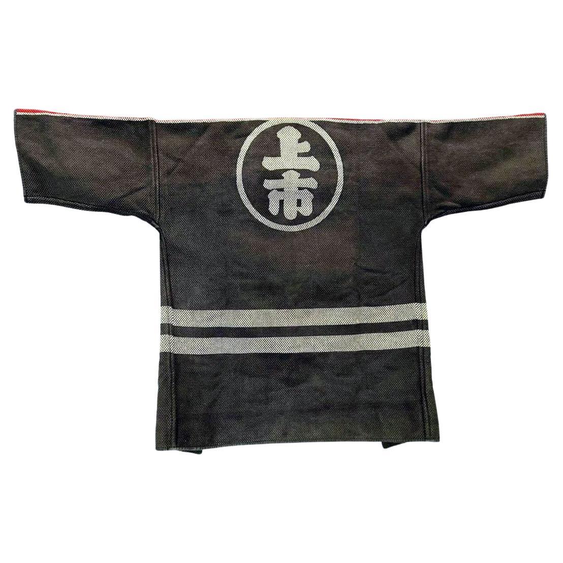 A vintage Japanese Fireman's Jacket (known as hikeshi-banten in Japanese) woven with heavy cotton and decorated with stencil resist dye circa 1920s Showa Period. These types of jackets were traditionally worn by firemen in Japan, a very important