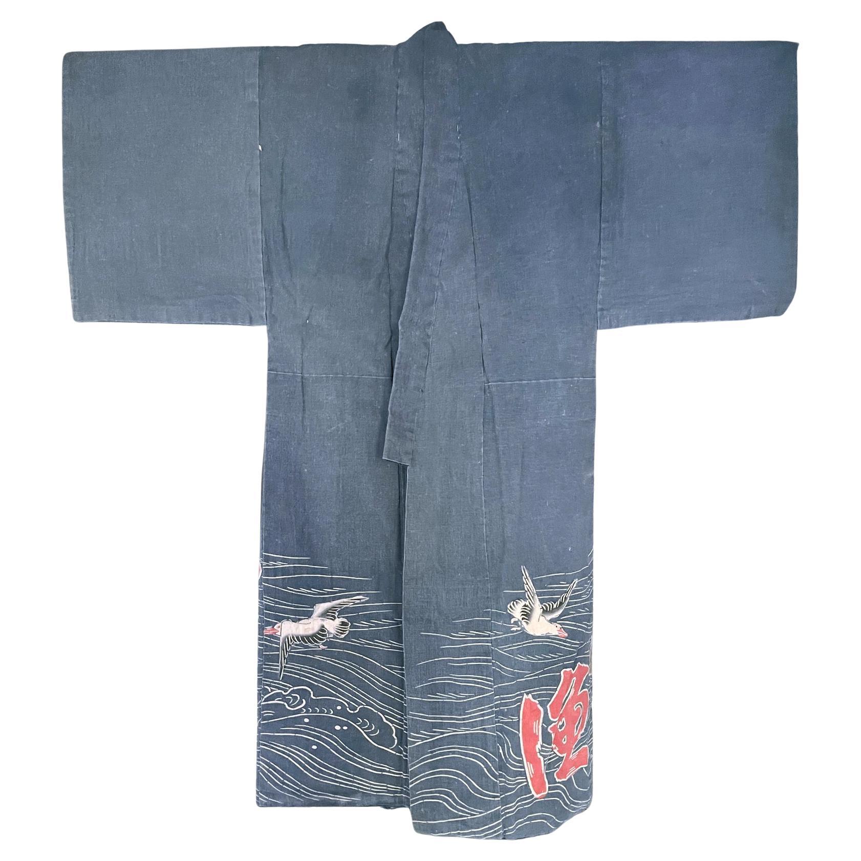 A Japanese festival Kimono robe circa late 19th to early 20th century (end of Meiji Period) for fishing ritual. Made in a cotton fabric, the kimono was elaborately decorated by Tsutsugaki, a free-hand resistant dye to create desired motifs. As a