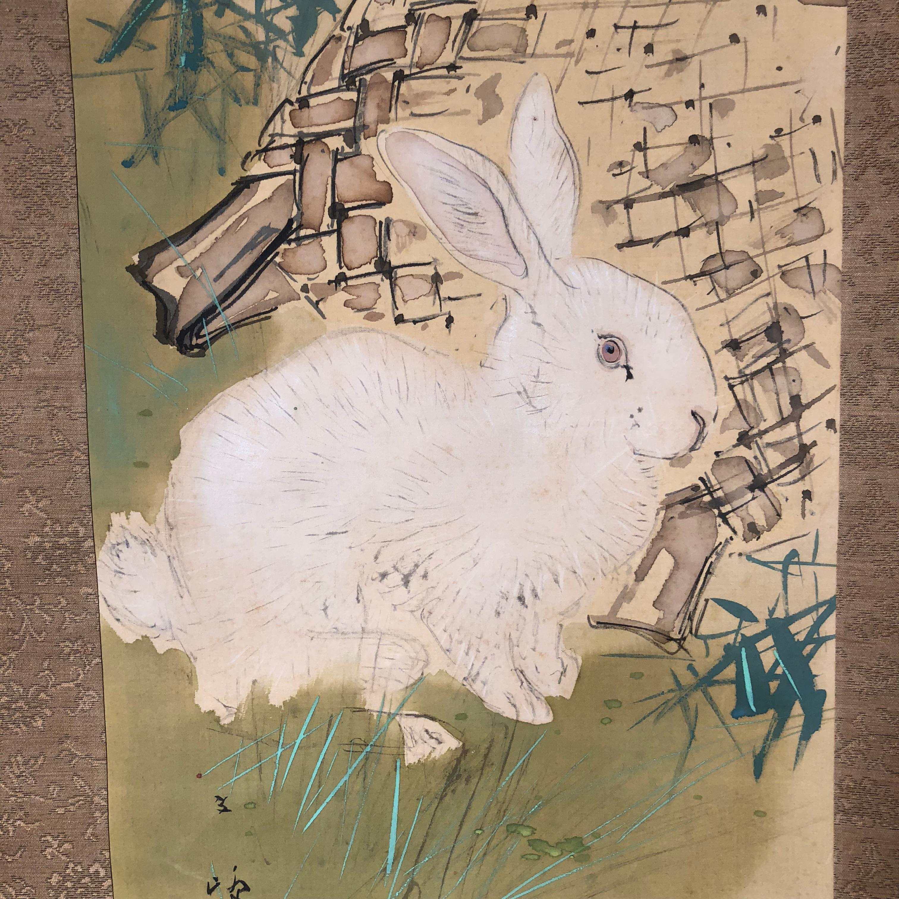 A beautiful and compelling Japanese antique hand-painted silk scroll of a charming rabbit and woven basket worthy of your favorite room.
Hand painting on silk in simple soft pleasing colors, signed.

Inscription:
Signed Shundo
Old Bone rollers,