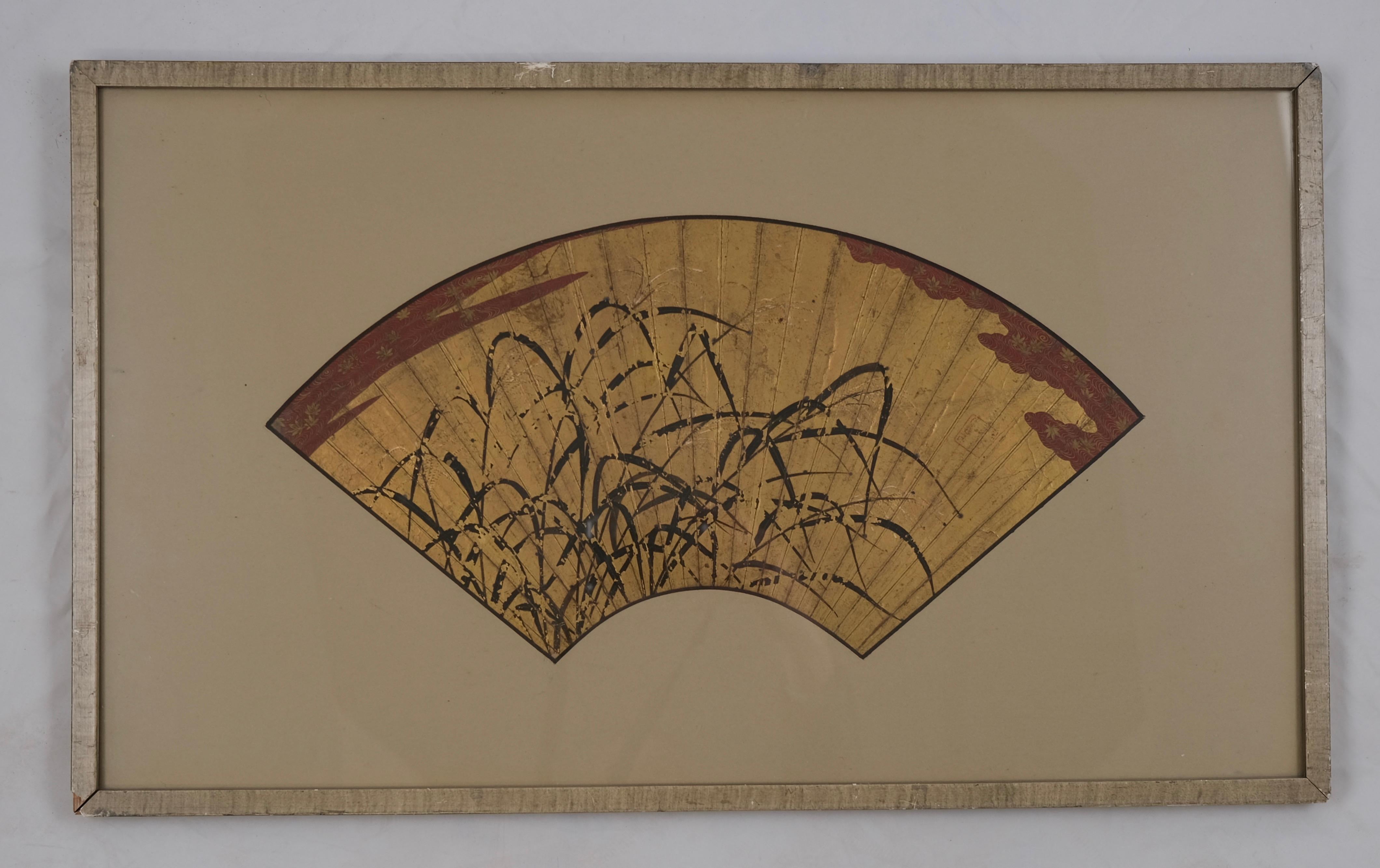 Japanese folding fan exquisitely painted in gold, red and black depicting bamboo central in the motive.

It has now mounted in a frame and is a great decoration. With frame the measurements are 68×37,5 cm just the fan measures 44×19 cm.

Signed