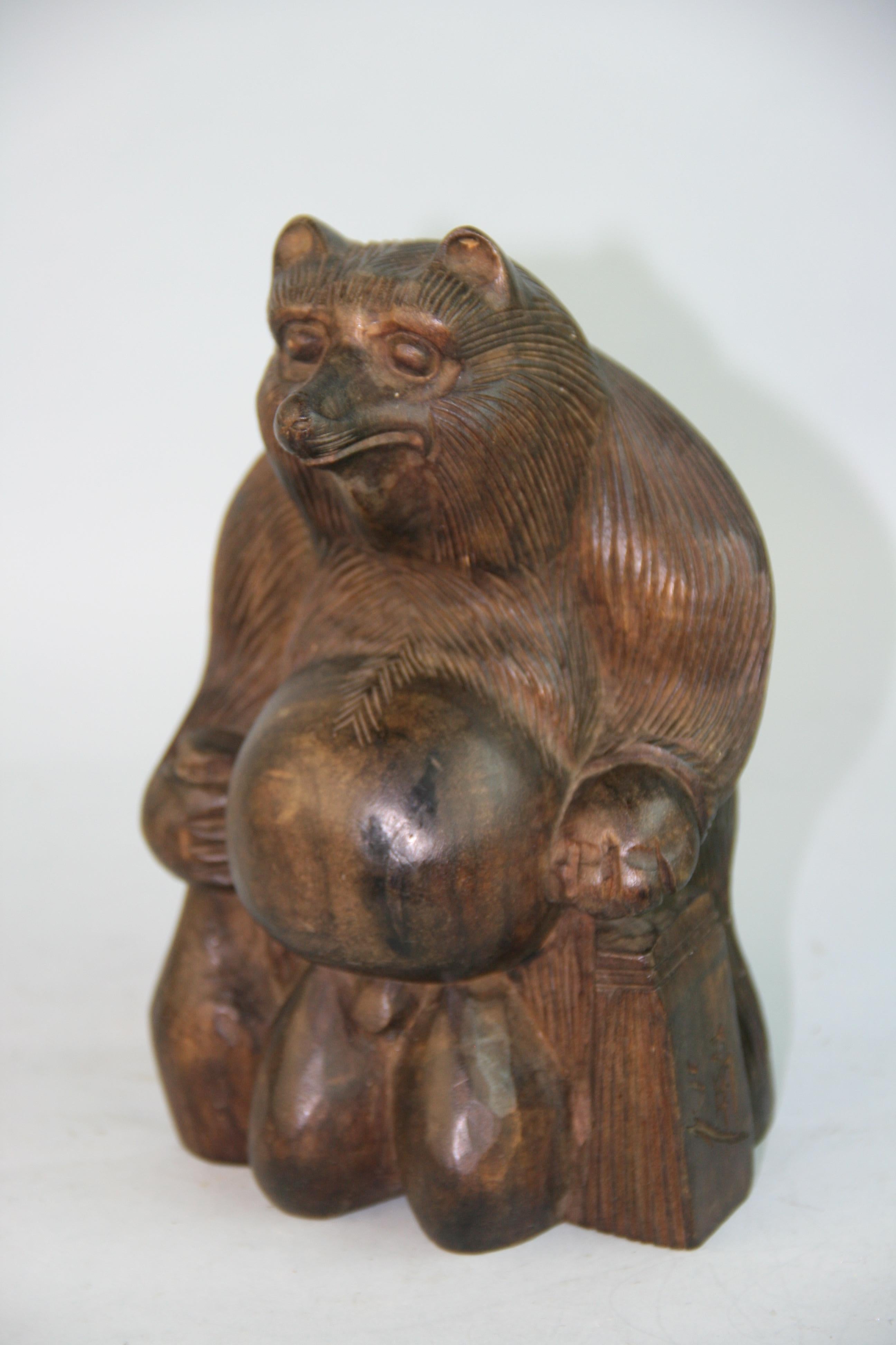 1195 Japan, this rare hand carved one of a kind big belly hardwood bear(actually a Folk Art hero raccoon dog Tanuki) awaits placement in your special place.
He holds a sake bottle in one hand and a sheaf of paper in the other.
Notable are his