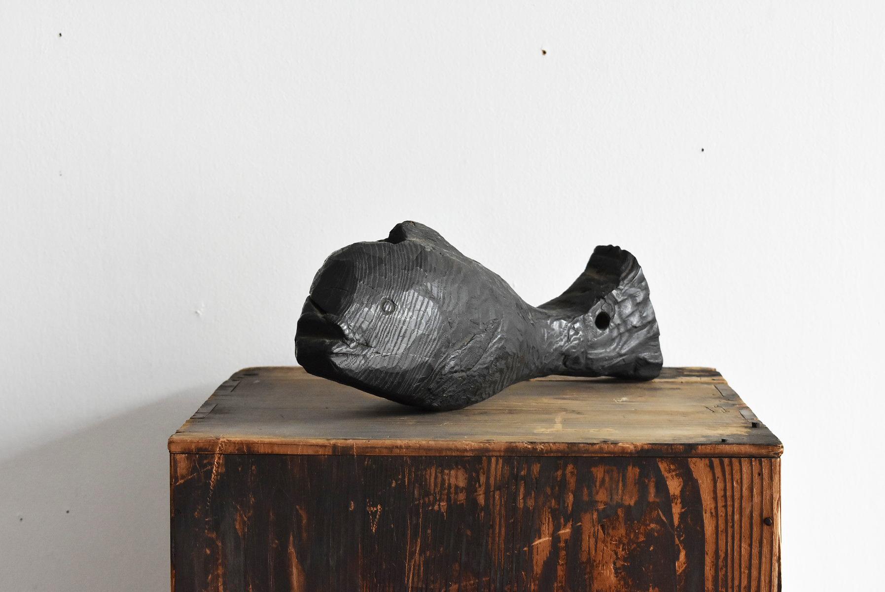 wooden carp sculpture