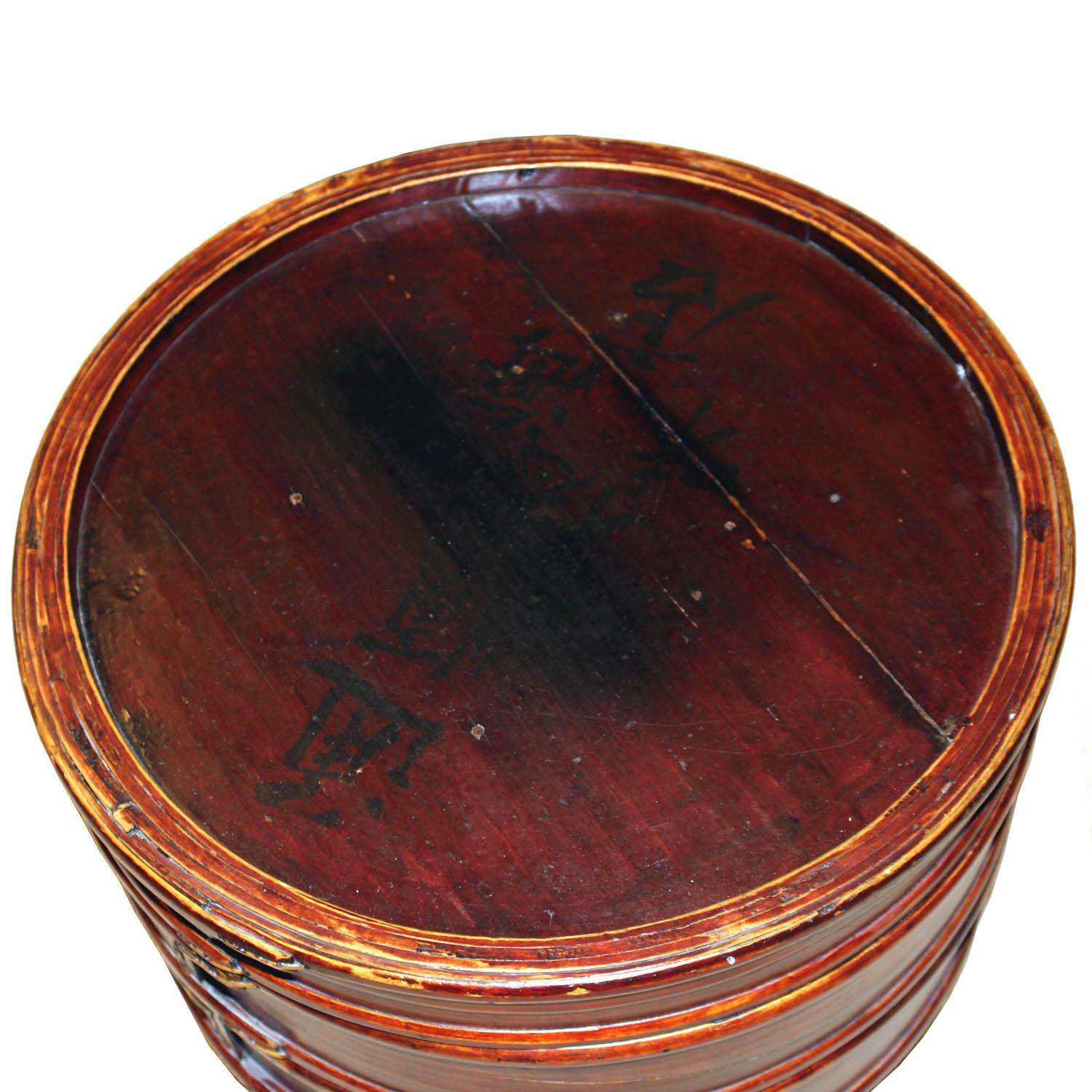 Stacked round food container was originally used to carry food for ceremonial festivities. Use as a side table and store accessories inside or place plants or orchids inside and display on a dining room table. New round wood base. Taisho period,