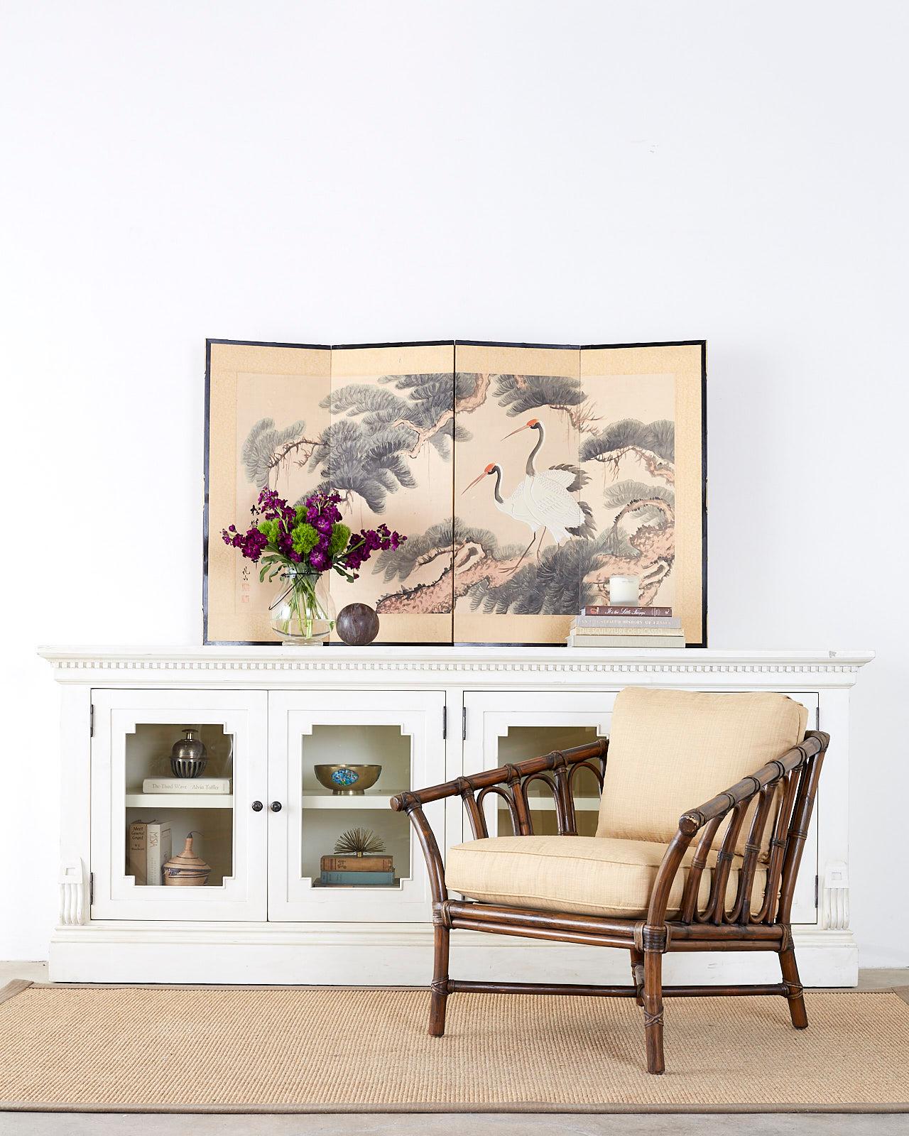 Beautiful Japanese four-panel byobu screen titled pine cranes and longevity. Depicts two red crowned cranes or Manchurian cranes perched in a pine tree. Lovely details with ink and color on silk ground. Signed and titled on left side by artiest