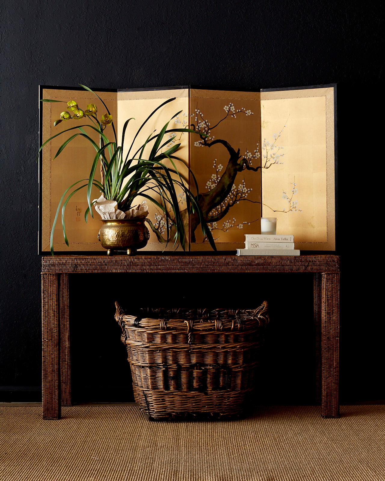 Attractive Japanese four panel byobu screen depicting an ancient Sakura tree or cherry blossom prunus tree in spring. Painted on squares of gold leaf and set in a black lacquered frame with a gold silk brocade border. The large symbolic tree is