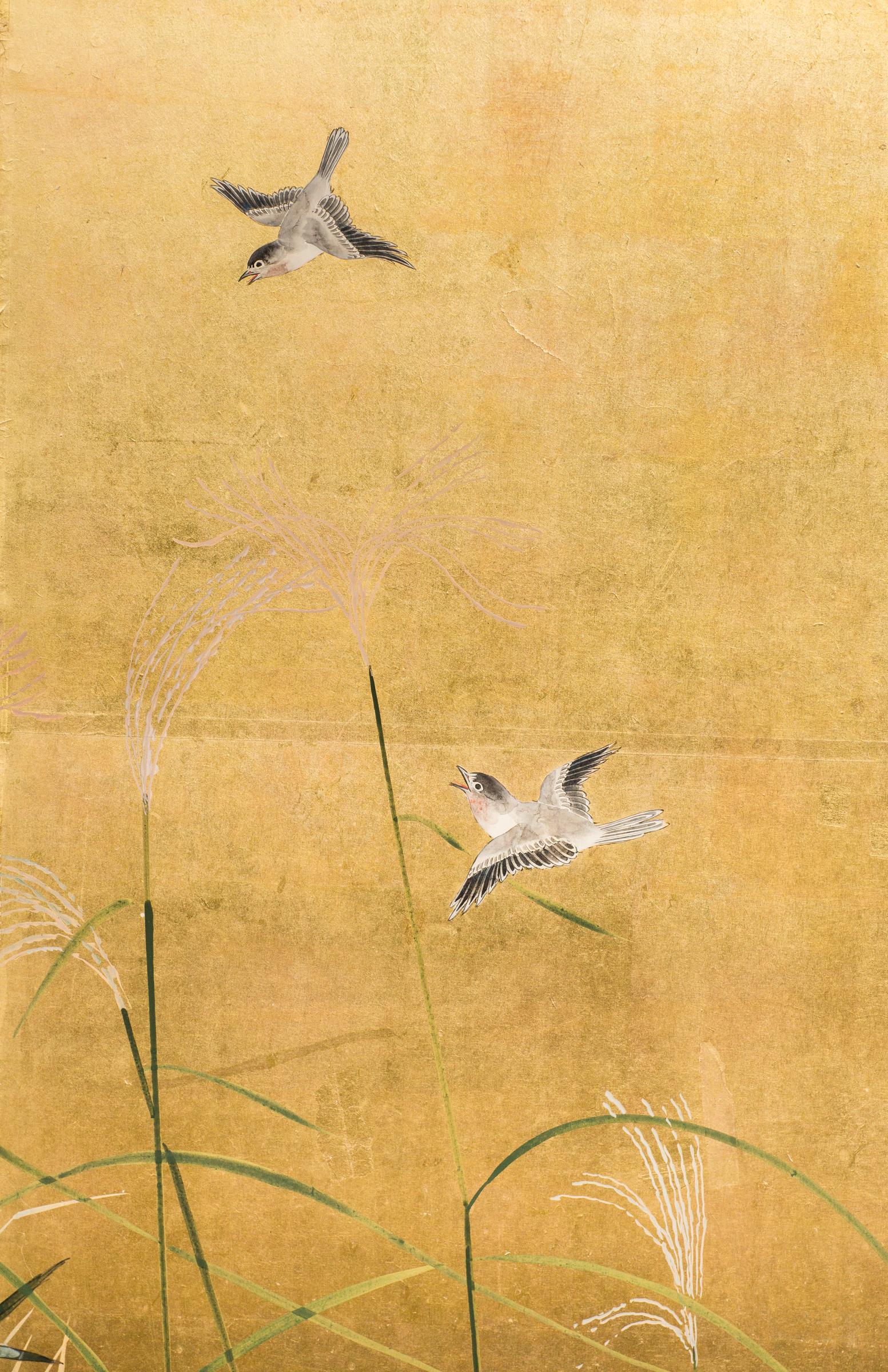 Taisho period painting (1912-1926) of a fall landscape with wild grasses, red maple, and dahlias. Mineral pigments on gold with a silk brocade border and beautiful metal mounts.