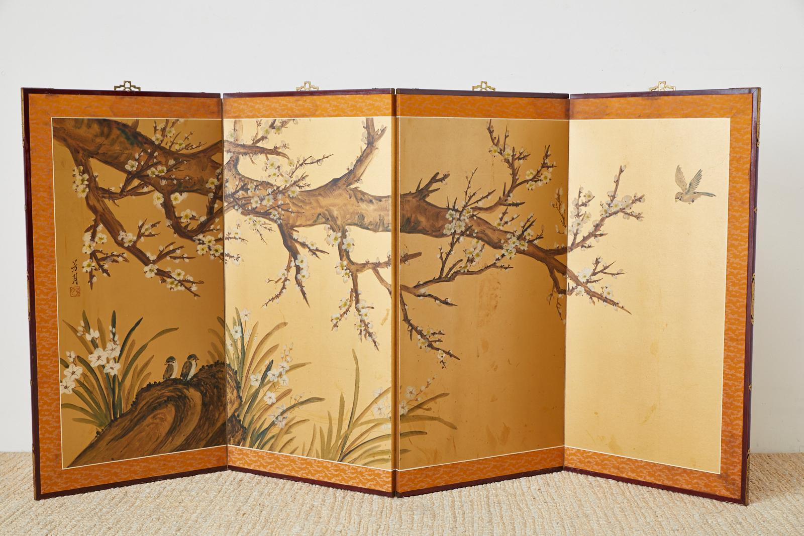Japanese Showa period four-panel screen depicting a large flowering plum tree, or prunus tree with sparrows. Painted over a gold leaf square background in the Nihonga school style. Ink and color pigments signed with a seal by artist Hogetsu. Set in