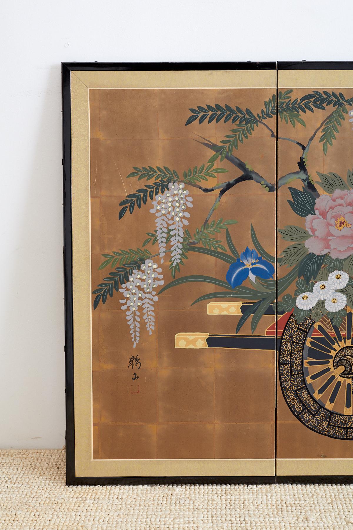 Lovely Japanese four-panel Byobu screen featuring a vibrant and colorful flower cart painted on squares of gold leaf with beautiful pink peonies, wisteria, white chrysanthemums, and little birds. Set in an ebonized wood frame with a traditional