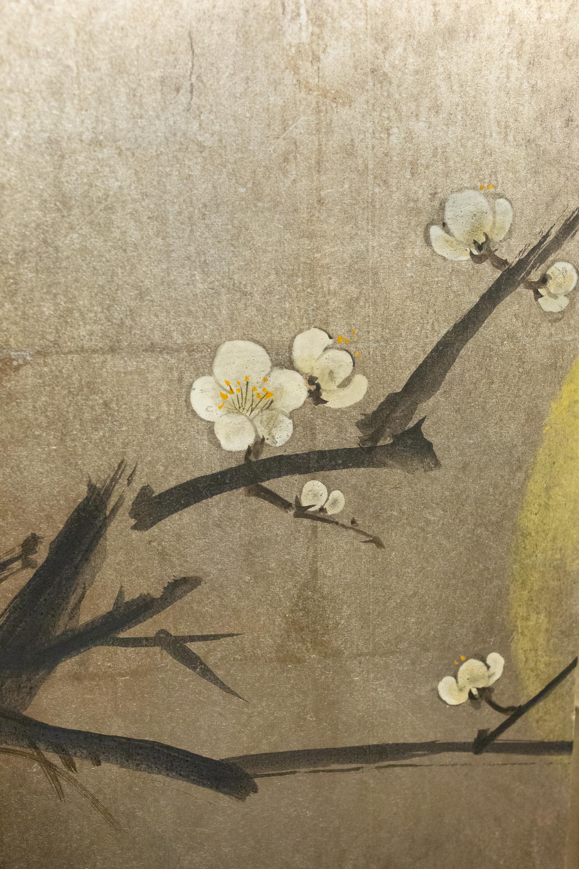 Plum blossoms against gold moon with bamboo on silver ground. Modern painting in mineral pigments on silver leaf with a silk brocade border.