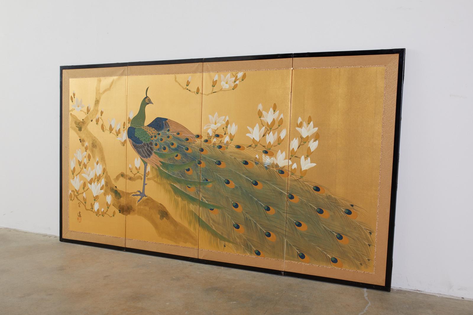 Gorgeous Japanese four-panel byobu screen featuring a peacock perched in a flowering magnolia tree. Made in the Nihonga school style with ink and color pigments on gilt squares. Signed by artist Soen with a seal. Set in a black lacquered wood frame