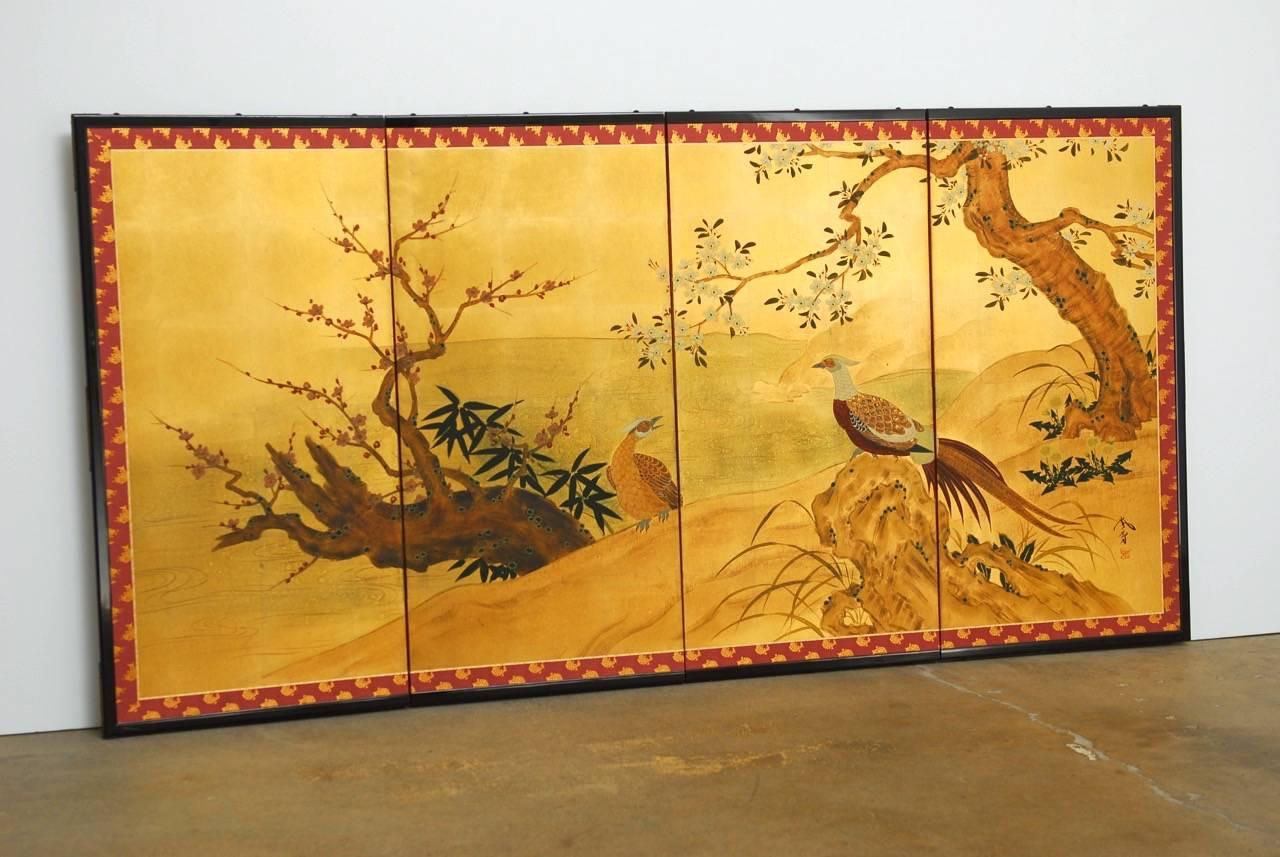 Colorful Japanese four-panel folding screen on gold leaf decorated with pheasants, cherry, and prunus. Made in Kyoto, Japan by famous artist Ransetsu and originally sold by Gumps. The screen was made in the traditional Byobu method using washi with