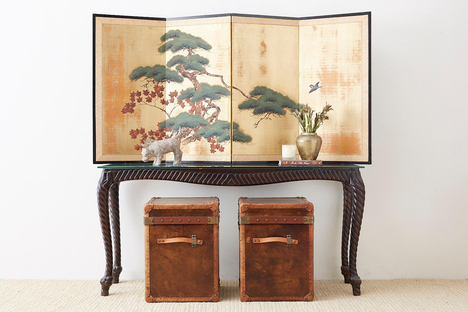 Midcentury Japanese four-panel screen depicting a pine tree and maple tree with a sparrow. Ink and color pigments over a printed silk ground of distressed squares of gilt. Set in a lacquered frame with a silk brocade border.