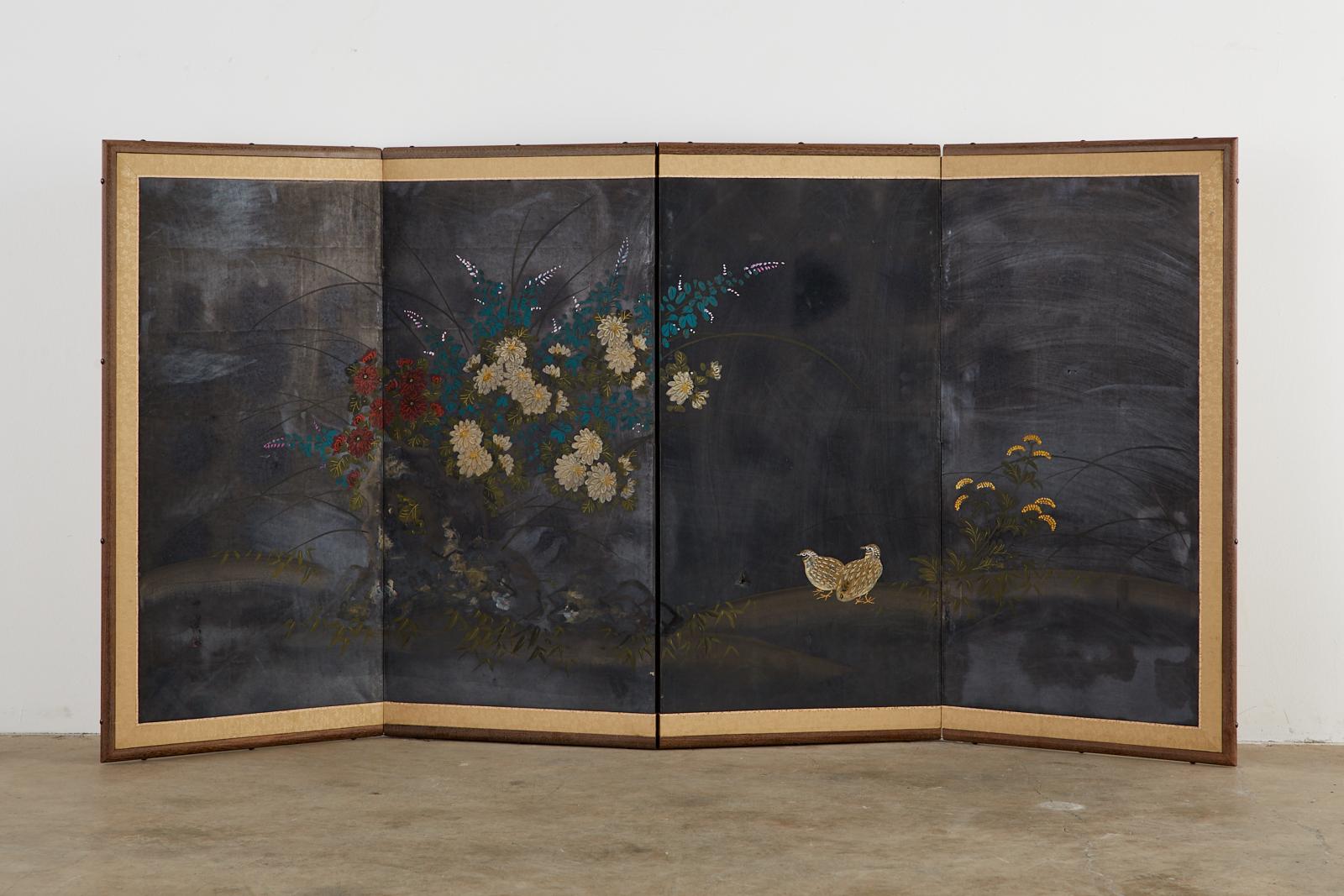Dramatic Japanese Showa period four-panel byobu screen depicting two quail. Set amid a floral landscape of peonies, iris, and grass, the screen has a dark, patinated silver background on the finish appearing almost black. Signed by artist with a