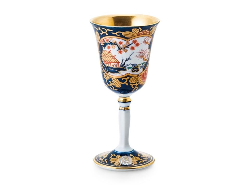Stunning contemporary Japanese Ko-Imari style short stem porcelain mug cup, intricately hand painted on a gracefully shaped body in cobalt blue, red and green and generous application of gold on a pure white porcelain, characteristic of Ko-Imari