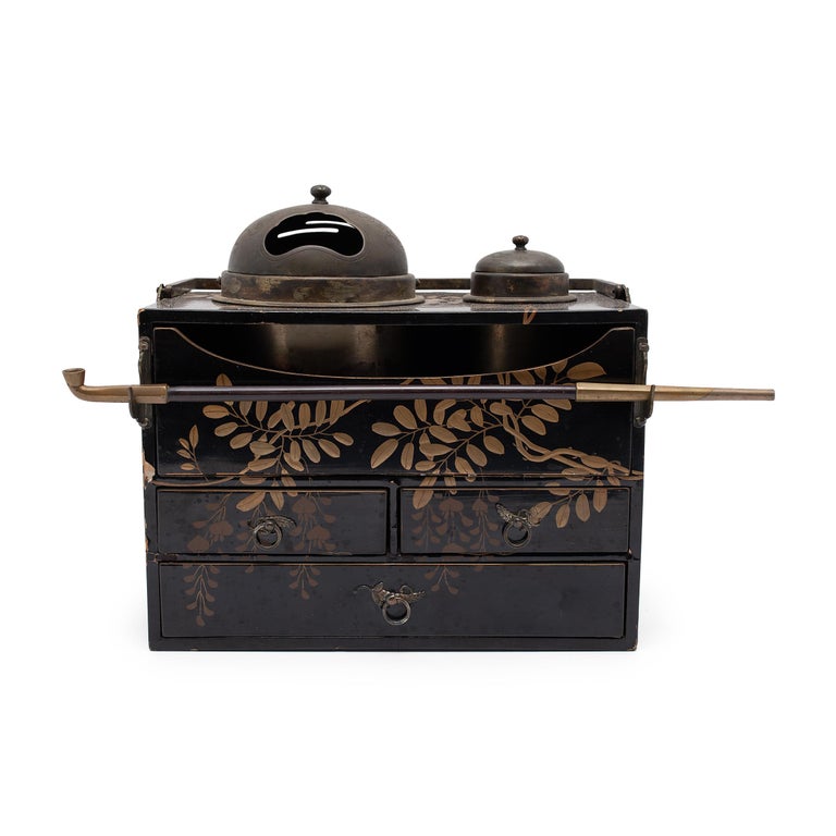 This box with many drawers is a Japanese tabako-bon, or 'tobacco tray,' used to store tobacco and smoking accessories. Believed to have evolved from the traditional accessories of Japanese incense ceremony, tabako-bons first came into use in the