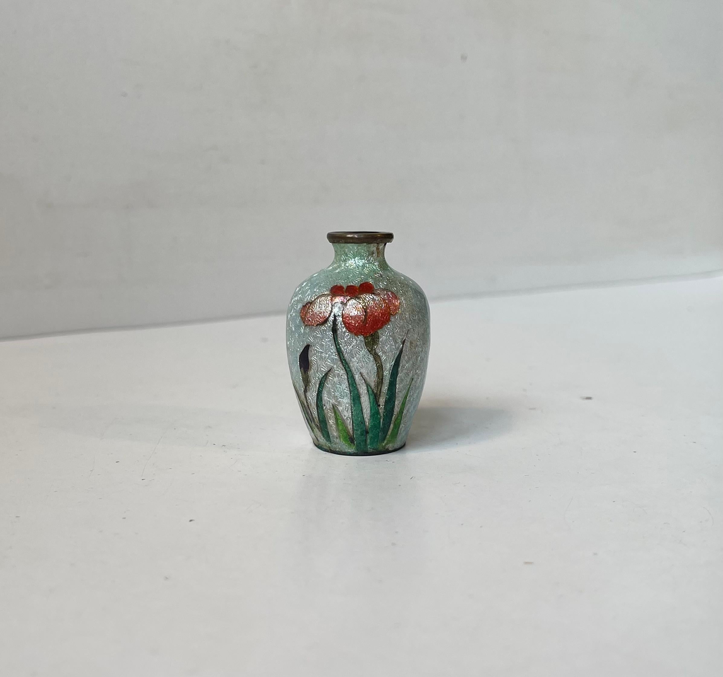 A stunning example of a Japanese foiled cloisonne miniature brass perfume bottle or incense vase hand-painted with decorative flowers. The shimmer from this piece is derived from a technique called as ginbari. A technique whereby textured foil