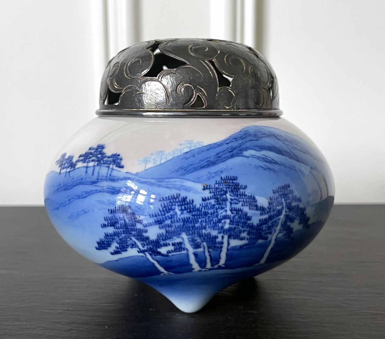 A tri-pod ceramic incense burner (koro) by Japanese Imperial potter Makuzu Kozan (1842-1916) circa late Meiji to the start of Taisho period (1890-1910s). A fine example of the artist's work belonging to the late part of his underglaze paint phase