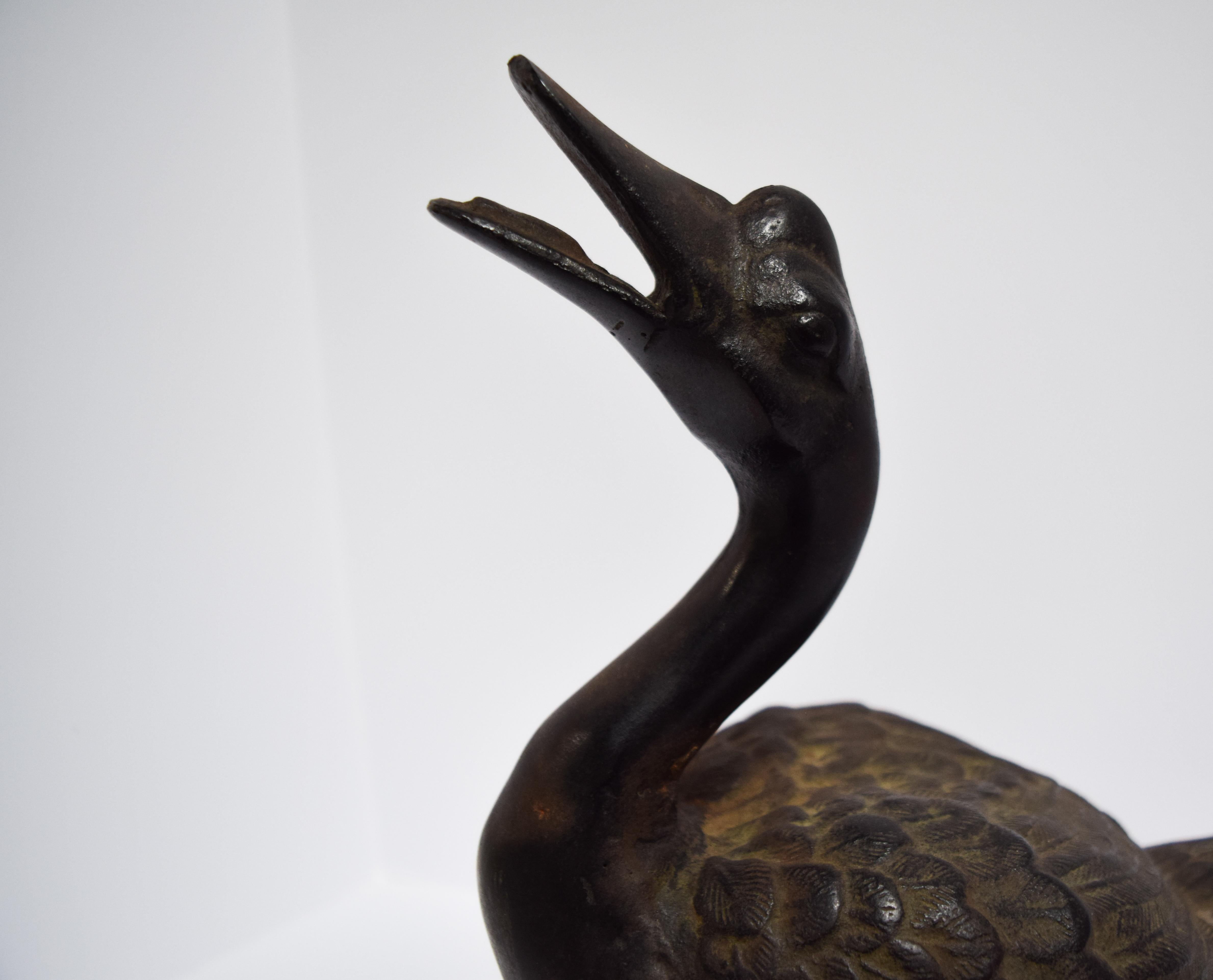 Edo period, mid-19th century. This highly detailed cast bronze Japanese goose is a symbol of longevity and luck. The webbing on the feet and feathers are meticulously sculpted and balanced beautifully with a naturally occurring patina.
From the