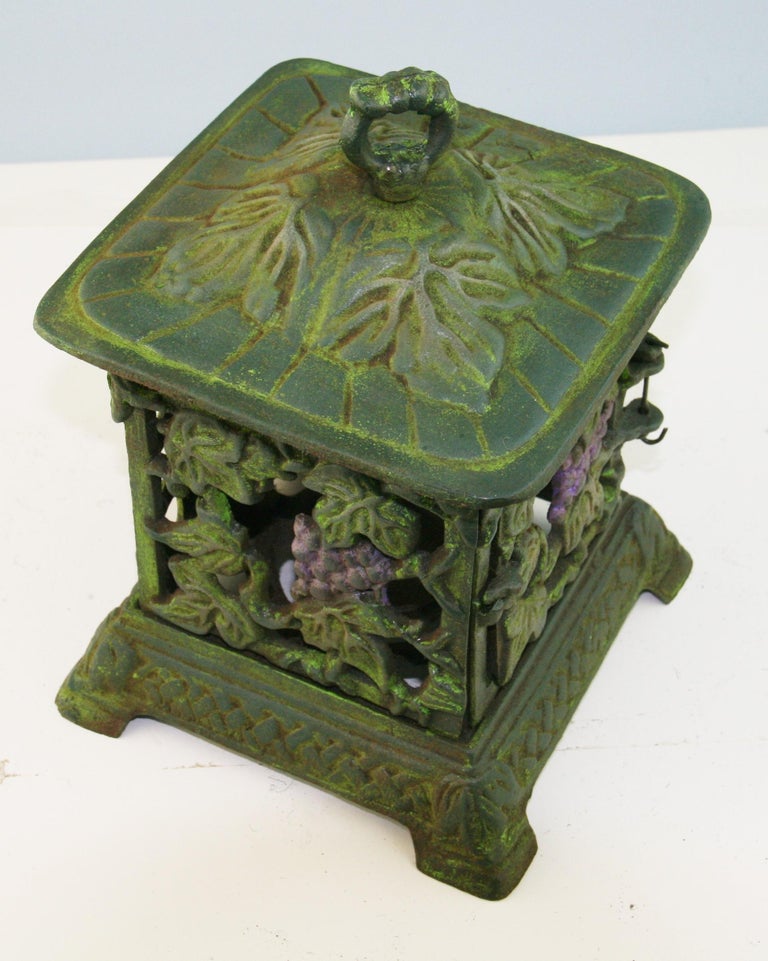 3-844 Japanese hand cast iron garden candle lantern with grapes and leaves.