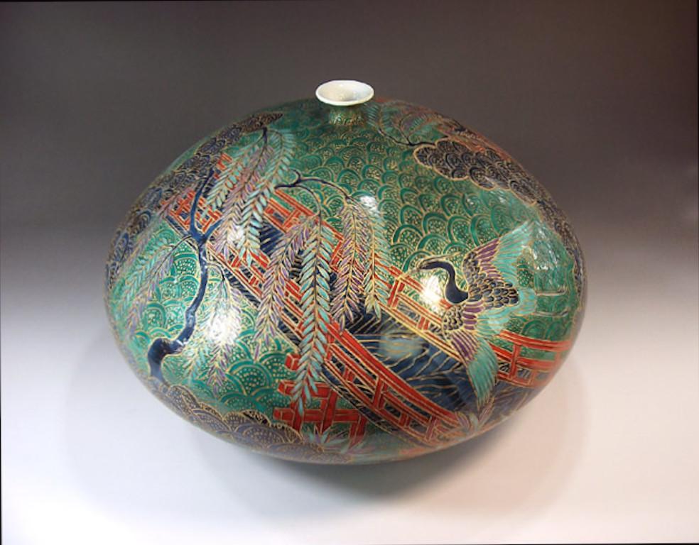 Exquisite contemporary Japanese decorative porcelain vase, hand-painted in green, red and gold, a signed masterpiece in his signature series by highly respected award-winning Japanese master porcelain artist in the Imari-Arita style. In 2016, the