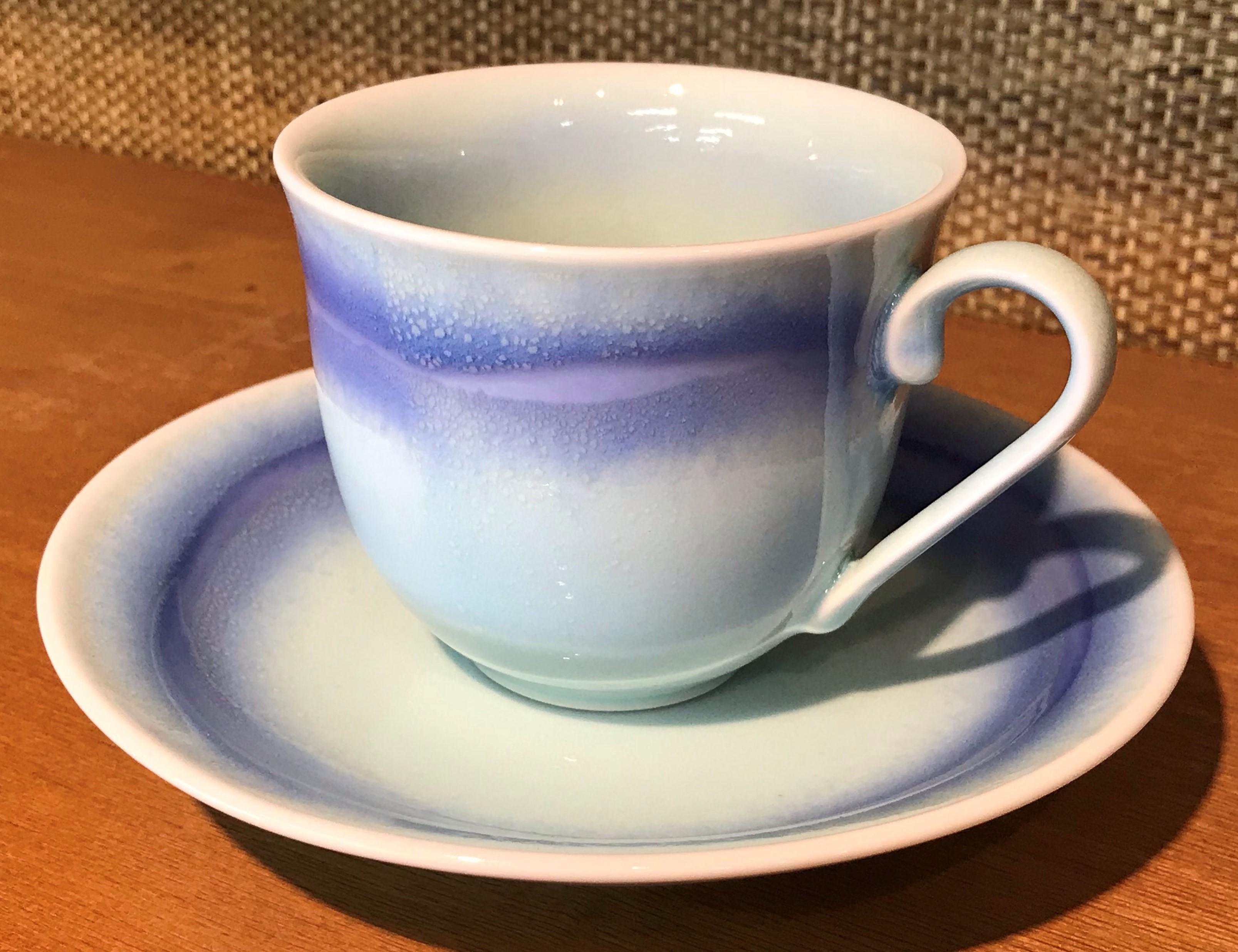 Exceptional Japanese contemporary porcelain cup and saucer, hand-glazed in stunning blue and white on a beautifully shaped body. This is a signed work by a highly acclaimed award-winning master porcelain artist from the Imari-Arita region of