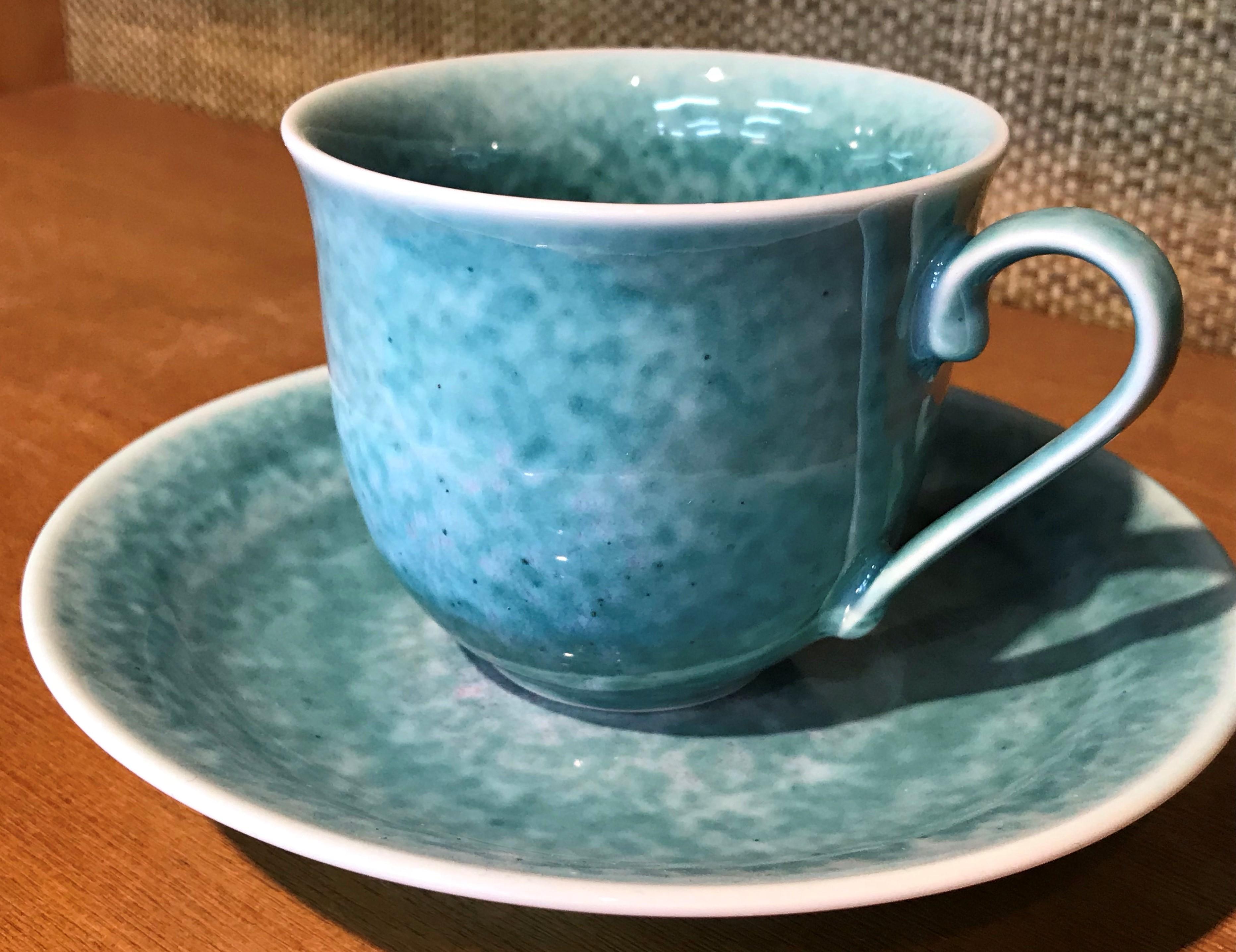 Exceptional Japanese contemporary porcelain cup and saucer, hand-glazed in a stunning turquoise blue on a beautifully shaped body. This is a signed work by a highly acclaimed award-winning master porcelain artist from the Imari-Arita region of