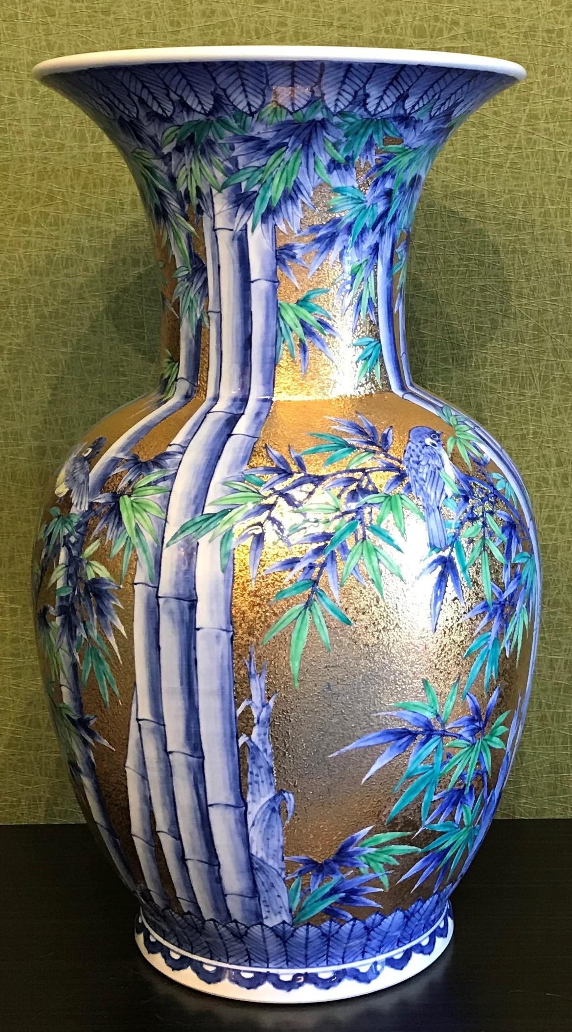 Extraordinary very large signed contemporary gilded porcelain vase, intricately hand painted on a stunningly shaped very large body accentuated by its extended neck and flared rim. This magnificent piece is a masterpiece by a highly acclaimed and