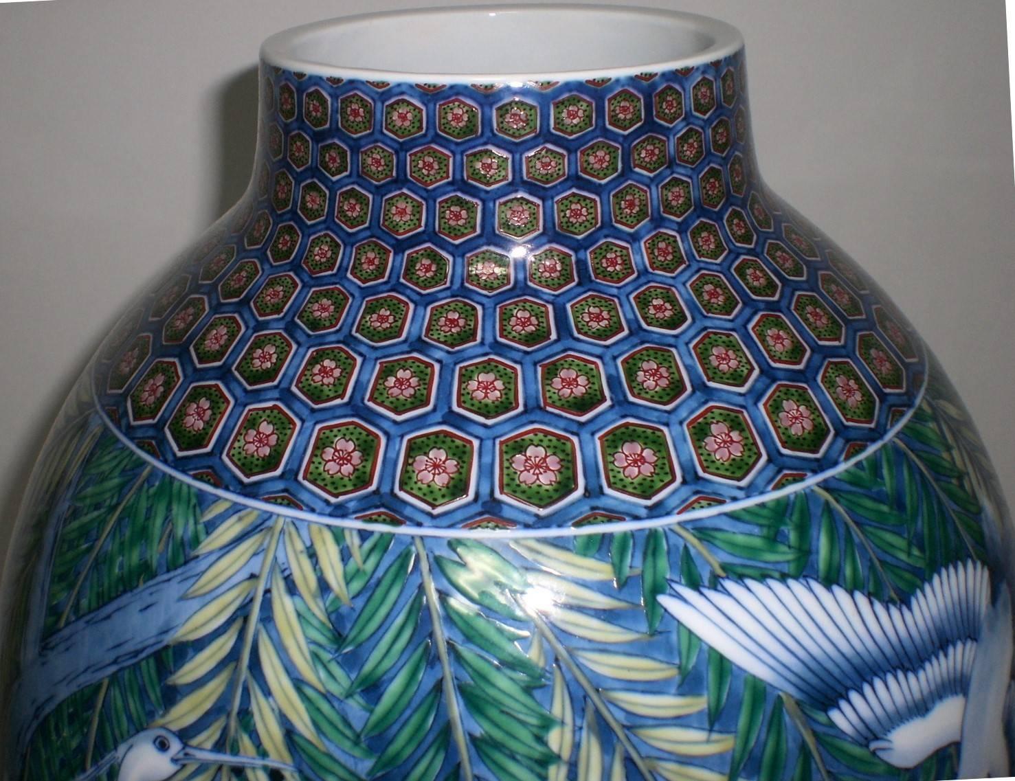 Unique Japanese Imari contemporary decorative porcelain vase, hand-painted on a stunningly shaped body, a masterpiece by master porcelain artist of the Imari-Arita region of southern island of Kyushu in Japan (1931-2009). He was admired for his