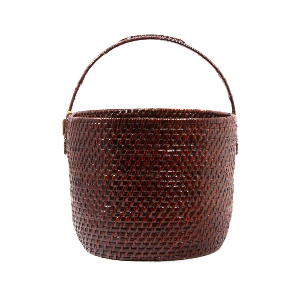 A vintage Japanese woven basket with handle. Originally sold through the celebrated New York Fifth Avenue retailer Takashimaya. Japan, circa 1940. Features a varnished finish.

Dimensions: 15.5 inches L × 13 inches D × 16 inches H