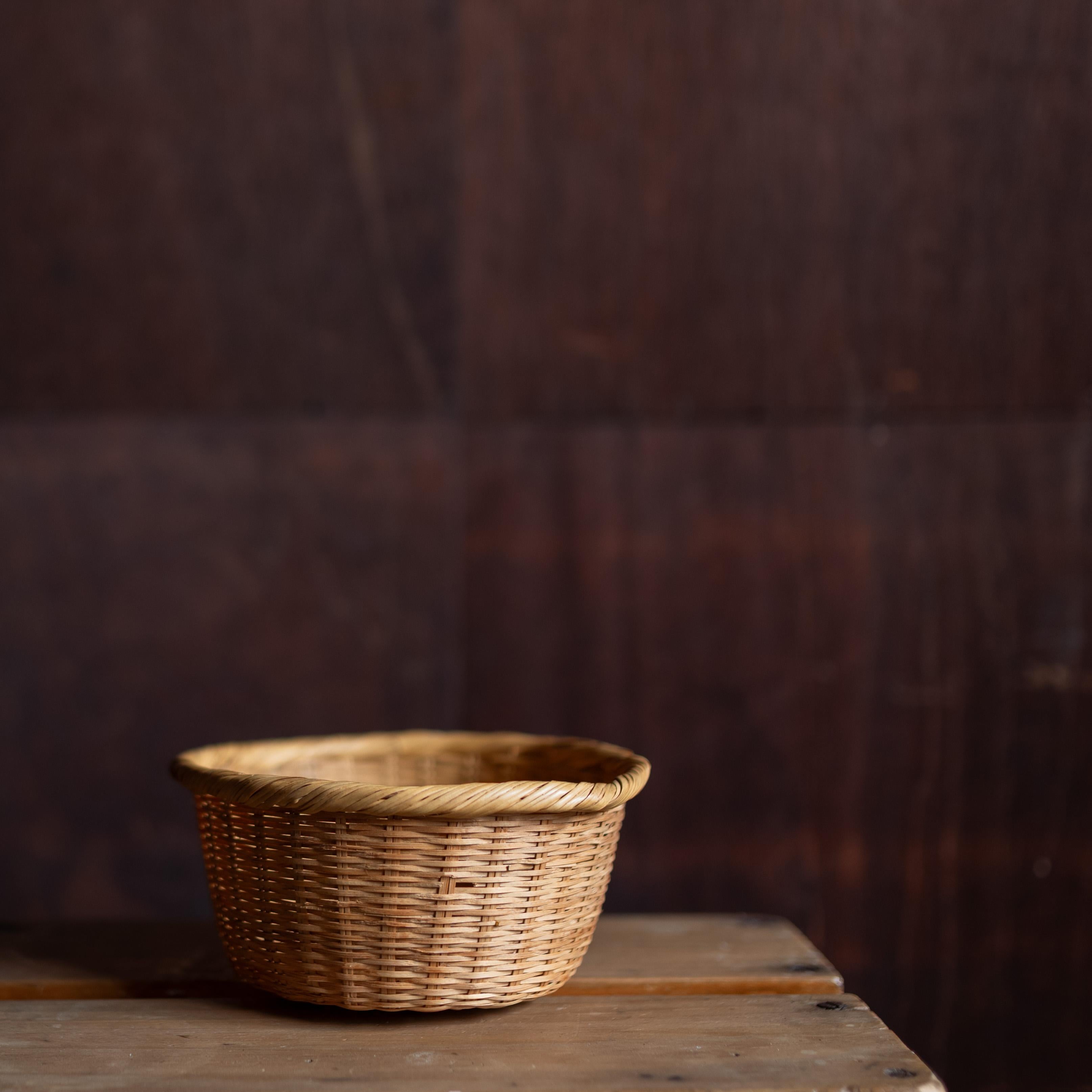 Beautifully handwoven basket from Japan, crafted with natural fibers in a traditional technique. Each piece demonstrates the refined balance of utility and simplicity characteristic of Japanese daily objects. The warm patina and subtle