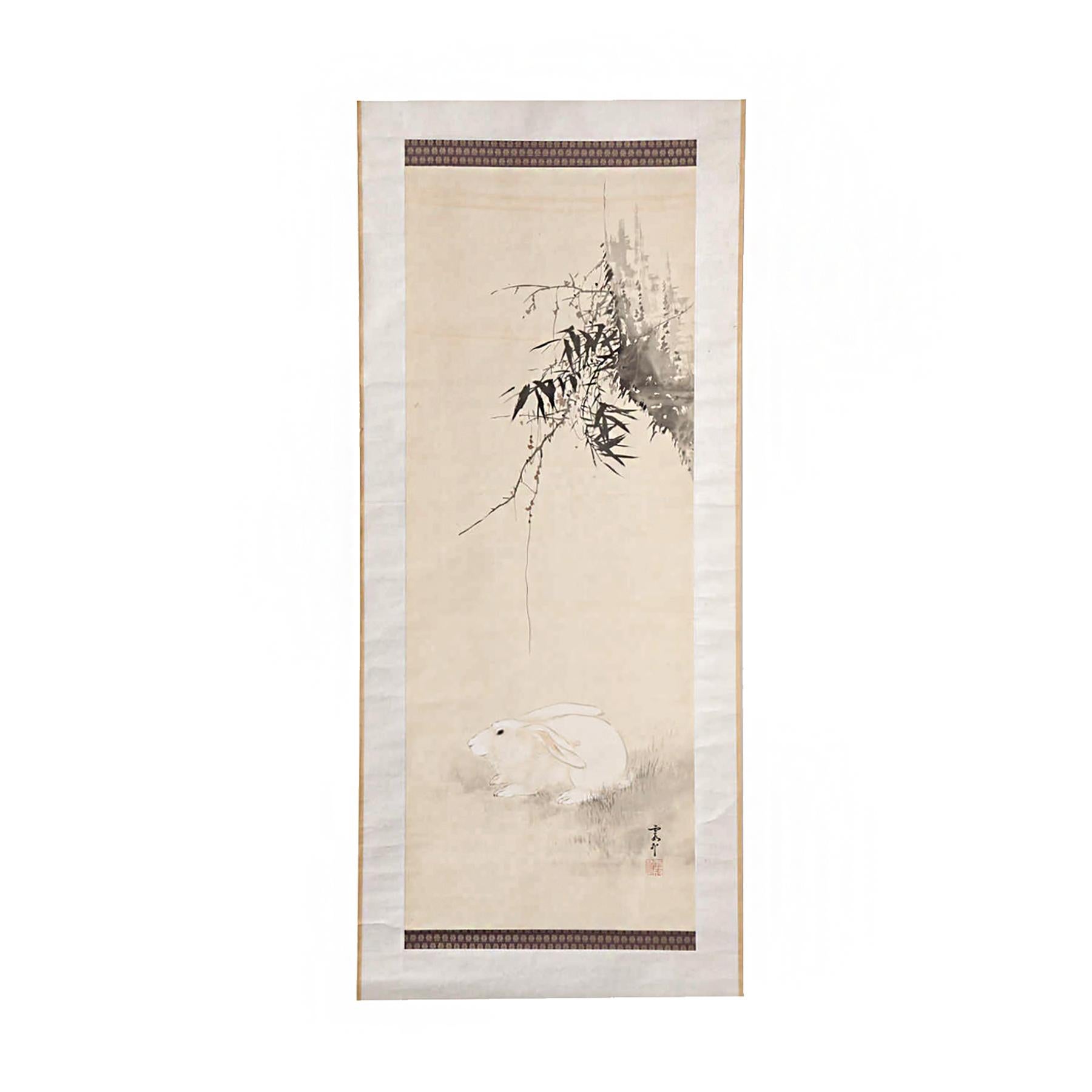 A Japanese hanging scroll or Kakejiku, circa 1890, depicting bamboo grass and a rabbit, framed by top and bottom ribbons of brocade silk.

 In Japanese culture, the rabbit is a symbol of cleverness and self-devotion. Bamboo is a symbol of