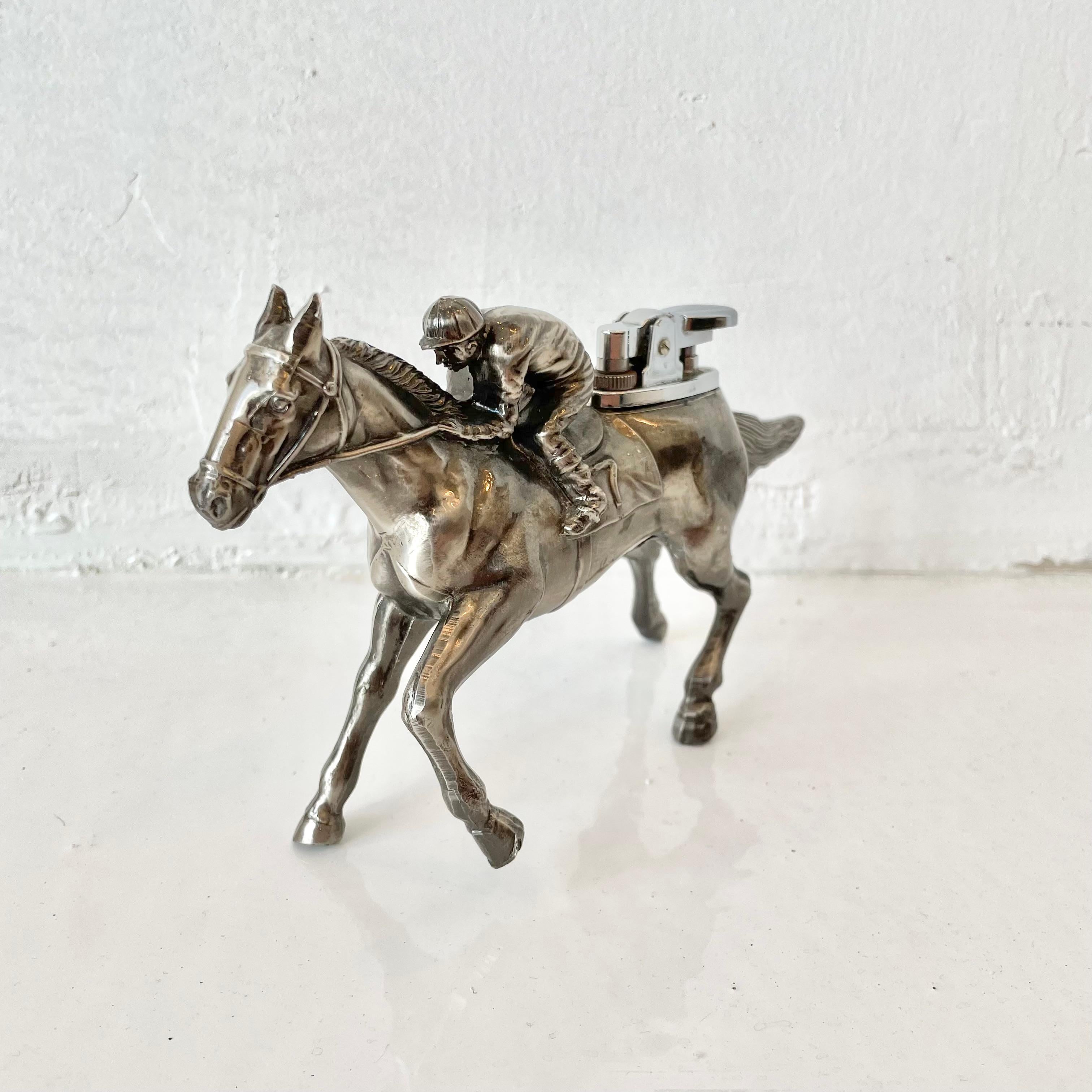 Whimsical vintage table lighter in the shape of a race horse and jockey. Made in Japan. Beautiful detail, heavy and substantial, helping it stand easily on its own. Cool tobacco accessory and conversation piece. Working lighter. Great vintage