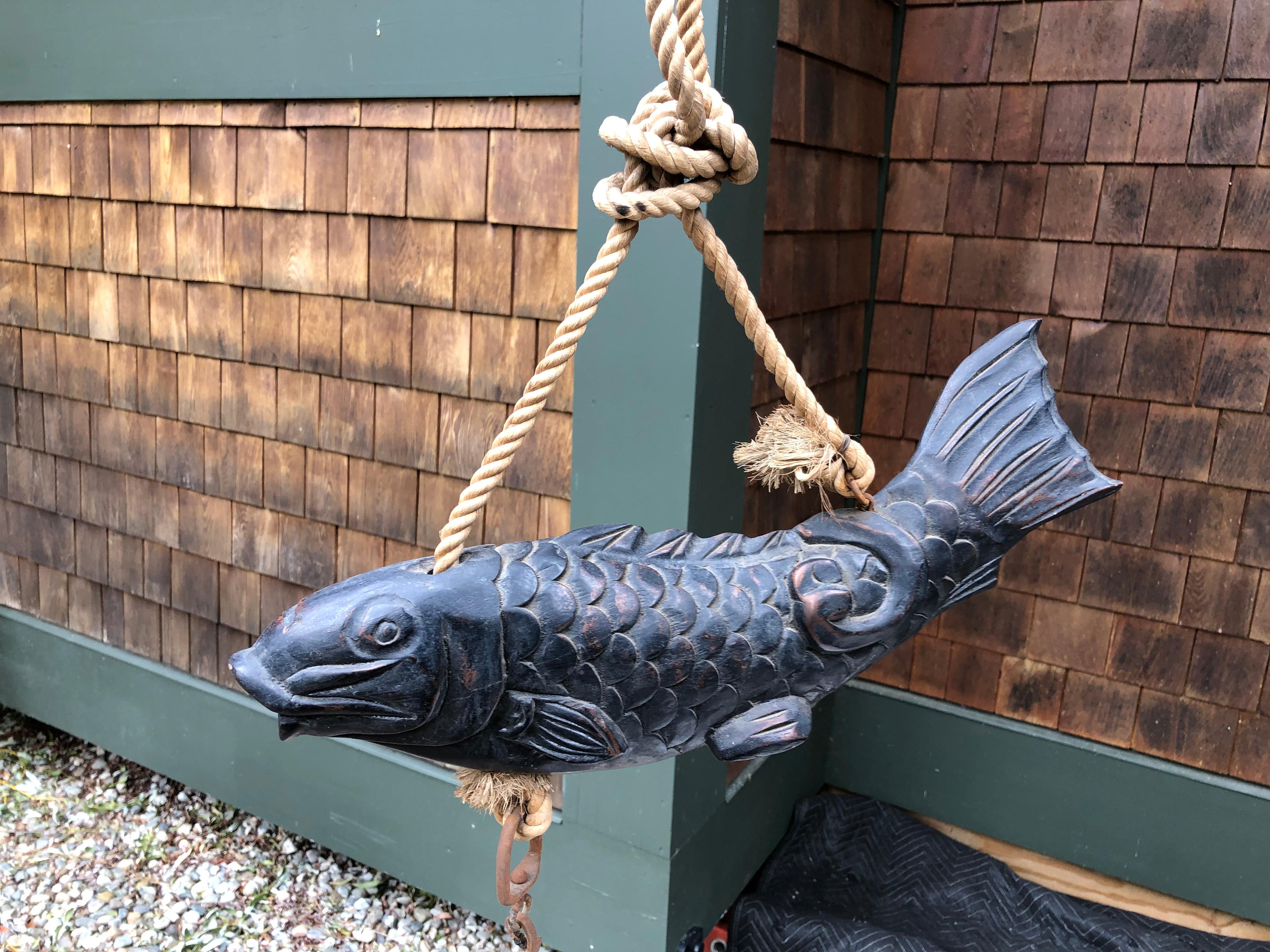 From our recent Japanese Acquisitions Travels- a large catch.

A large scale fine old Japanese 19th century hand carved wooden KOI fish symbolic of prosperity, perseverance and good fortune. This big fish holds the round ball like wish granting