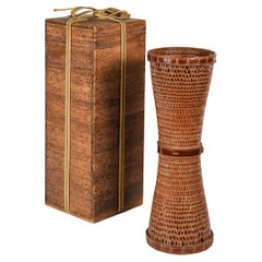 Japanese Ikebana or hanakago wicker basket of elongated and conic shape