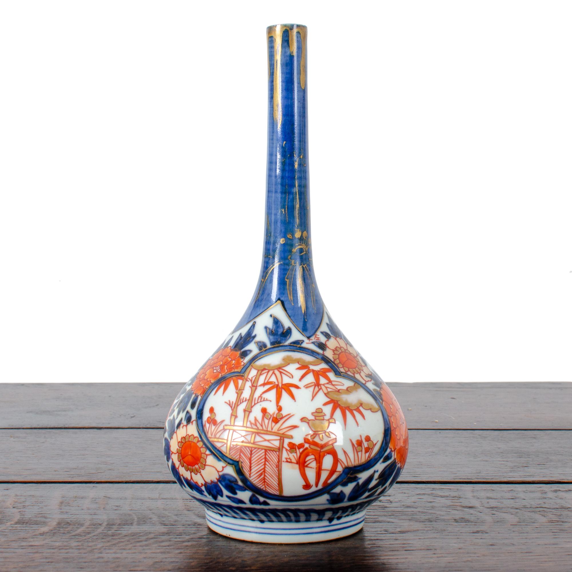 A Japanese imari bottle vase, 19th Century.  Signed. 



4 ¾ inches wide

9 ½ inches tall



