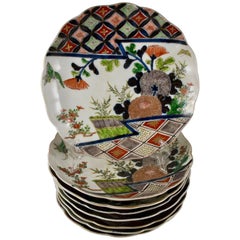 Japanese Imari Enameled Porcelain Floral and Geometric Plates, Set of Eight