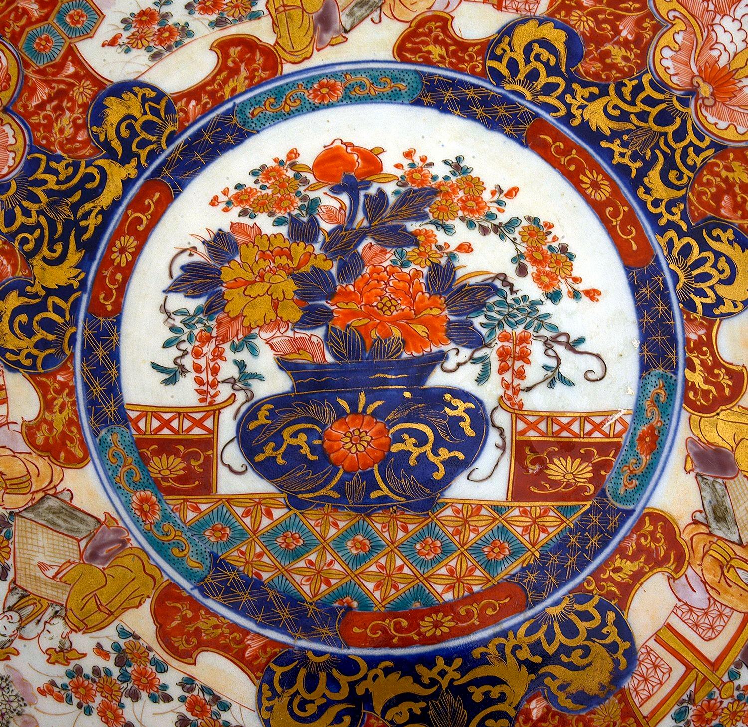 A very good quality late 19th Century Japanese Imari charger, having wonderful orange ground with scrolling foliate gilded highlights, motif decoration too the boarders, inset hand painted panels depicting various courtiers.

Batch 82. N/H