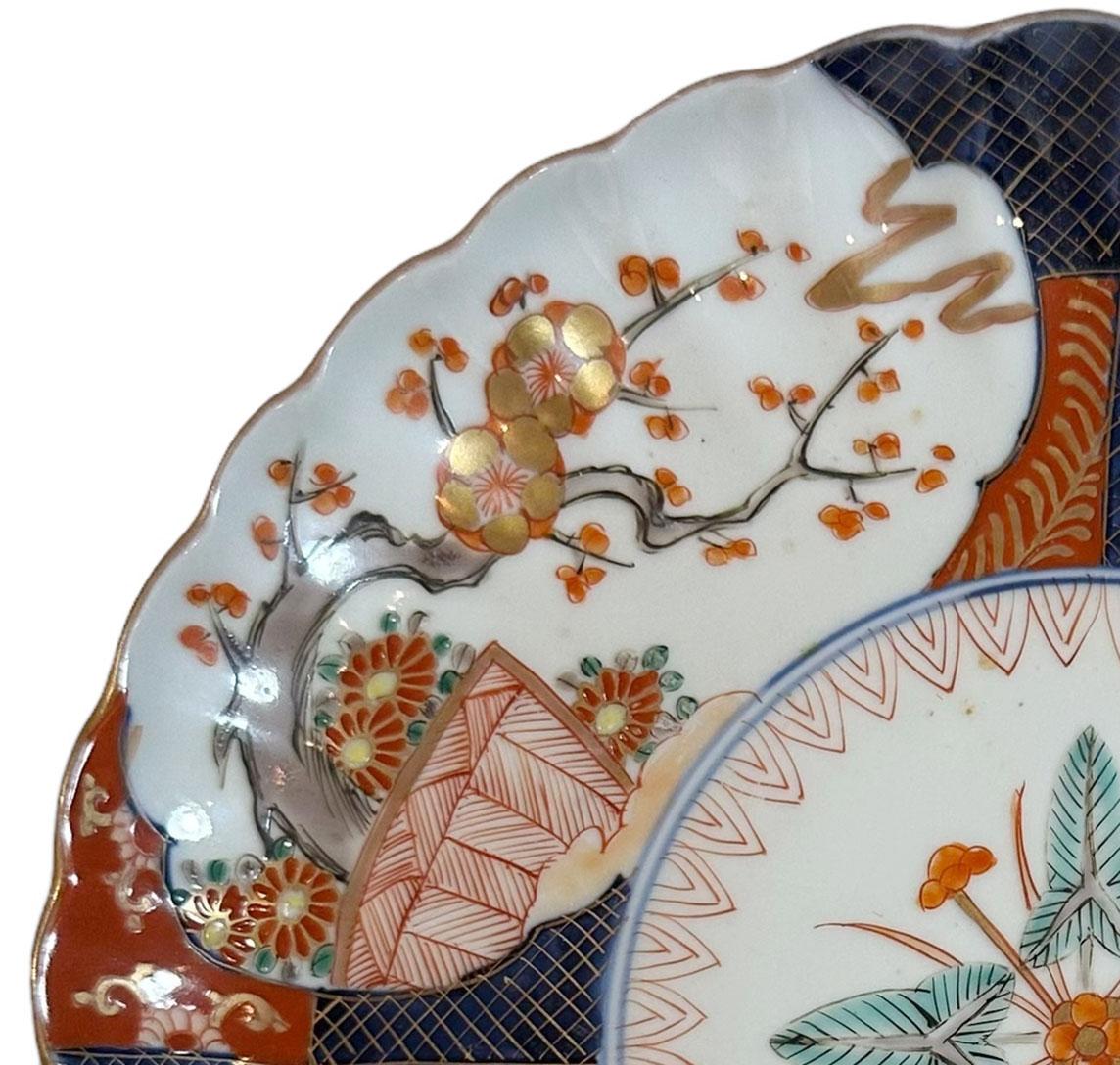 A late 19th century Japanese Imari plate that is very finally painted and with a scalloped edge. Plate is signed in Japanese on the back. 
