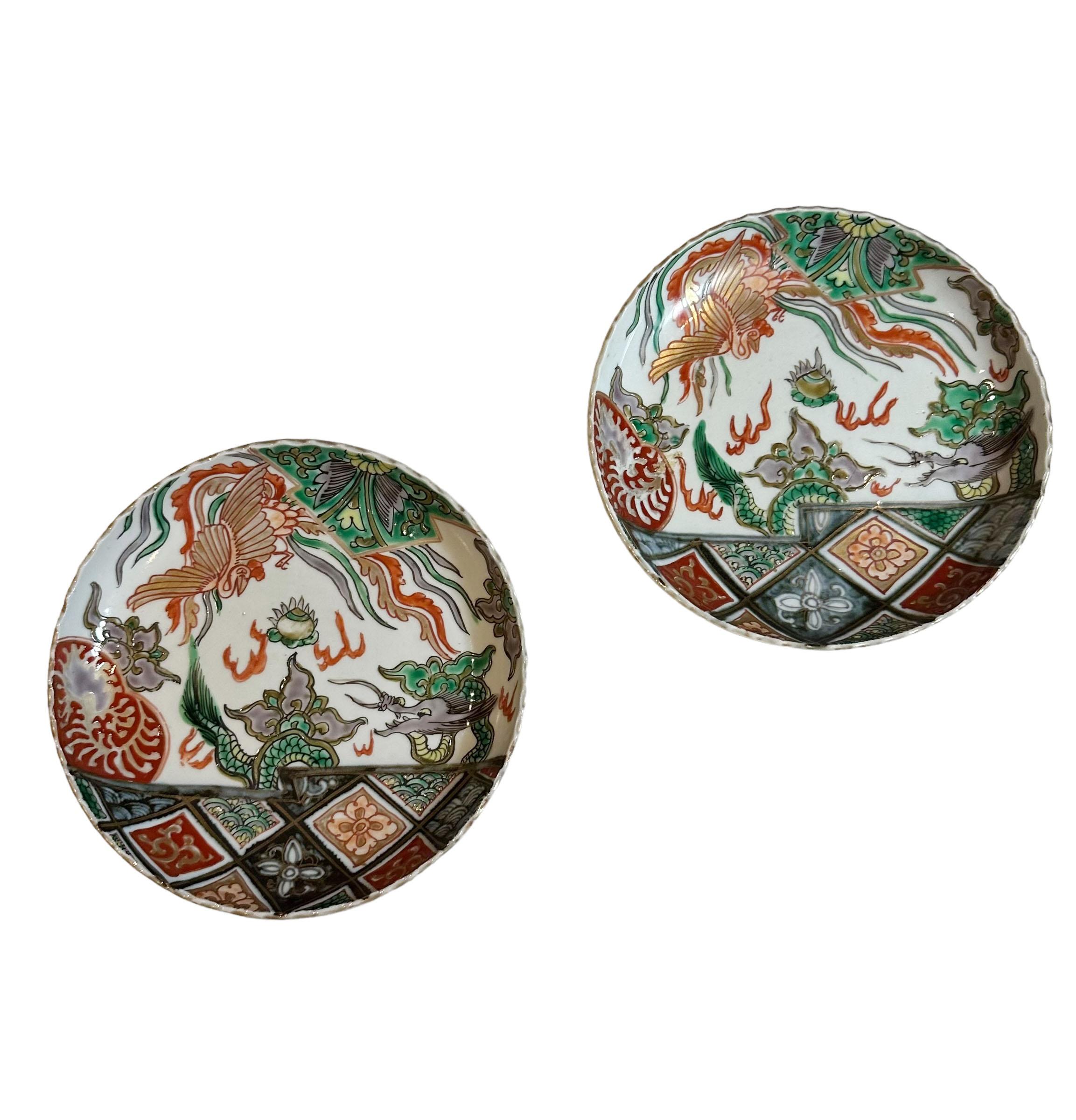 A pair of turn of the century Japanese Imari small plates with a small scalloped edge. From a very large collection of Imari. 