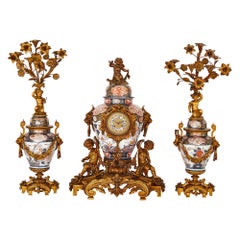 Japanese Imari Porcelain and Gilt Bronze Clock Set
