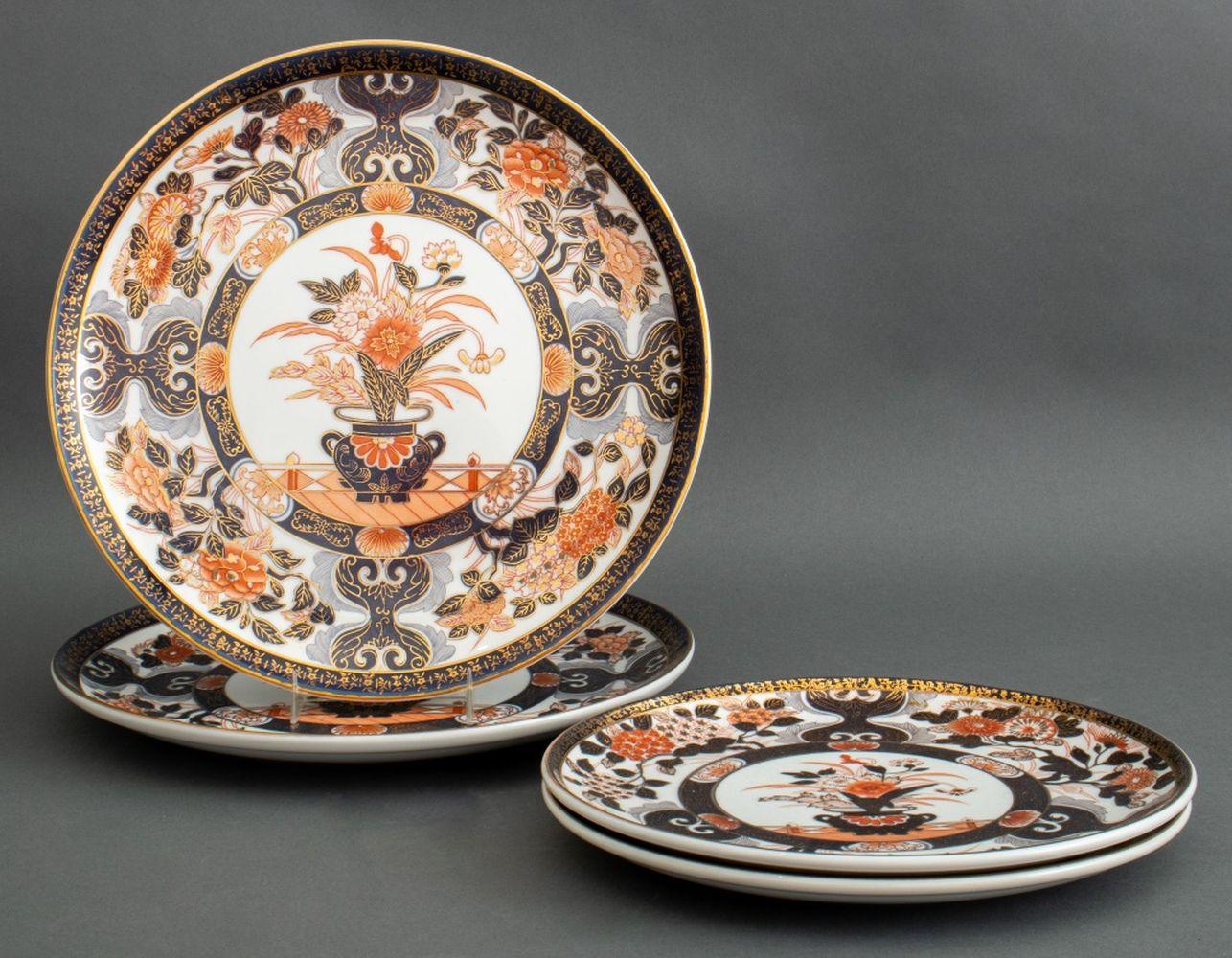 Set of Four Japanese Imari Porcelain Plates, with floral vase motif to center medallion, comprising of: two dinner plates and two chargers. Larger: 12.5