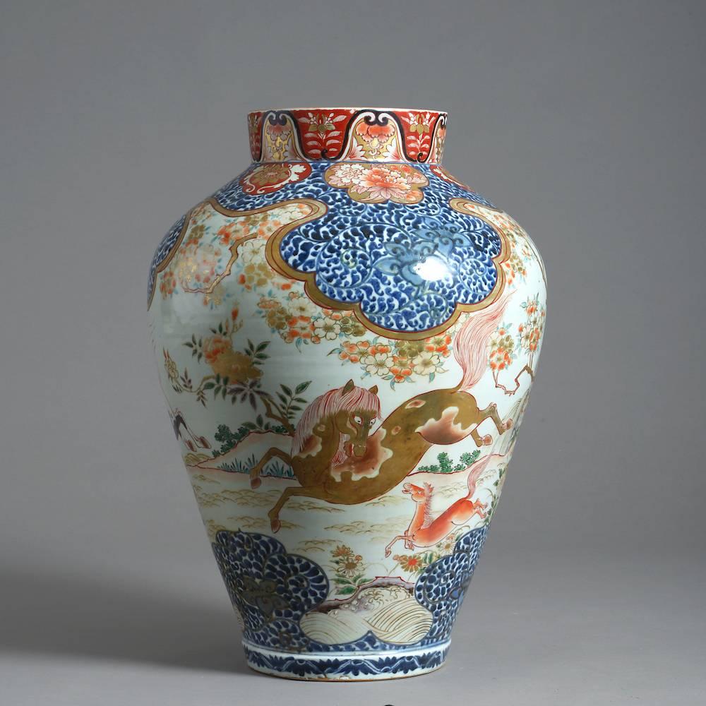 A fine and large Japanese Imari vase decorated with prancing horses, circa 1700.