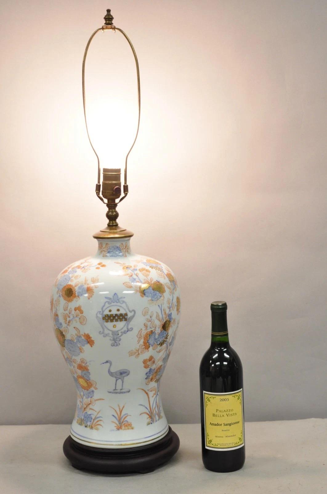 Antique Japanese Imari Vase Oriental Blue Porcelain Armorial Ginger Jar Table Lamp w/ Hand Painted Crane and Orange, Blue, and Gold Flowers on Wooden Base. Circa Early 20th Century. Measurements: 32