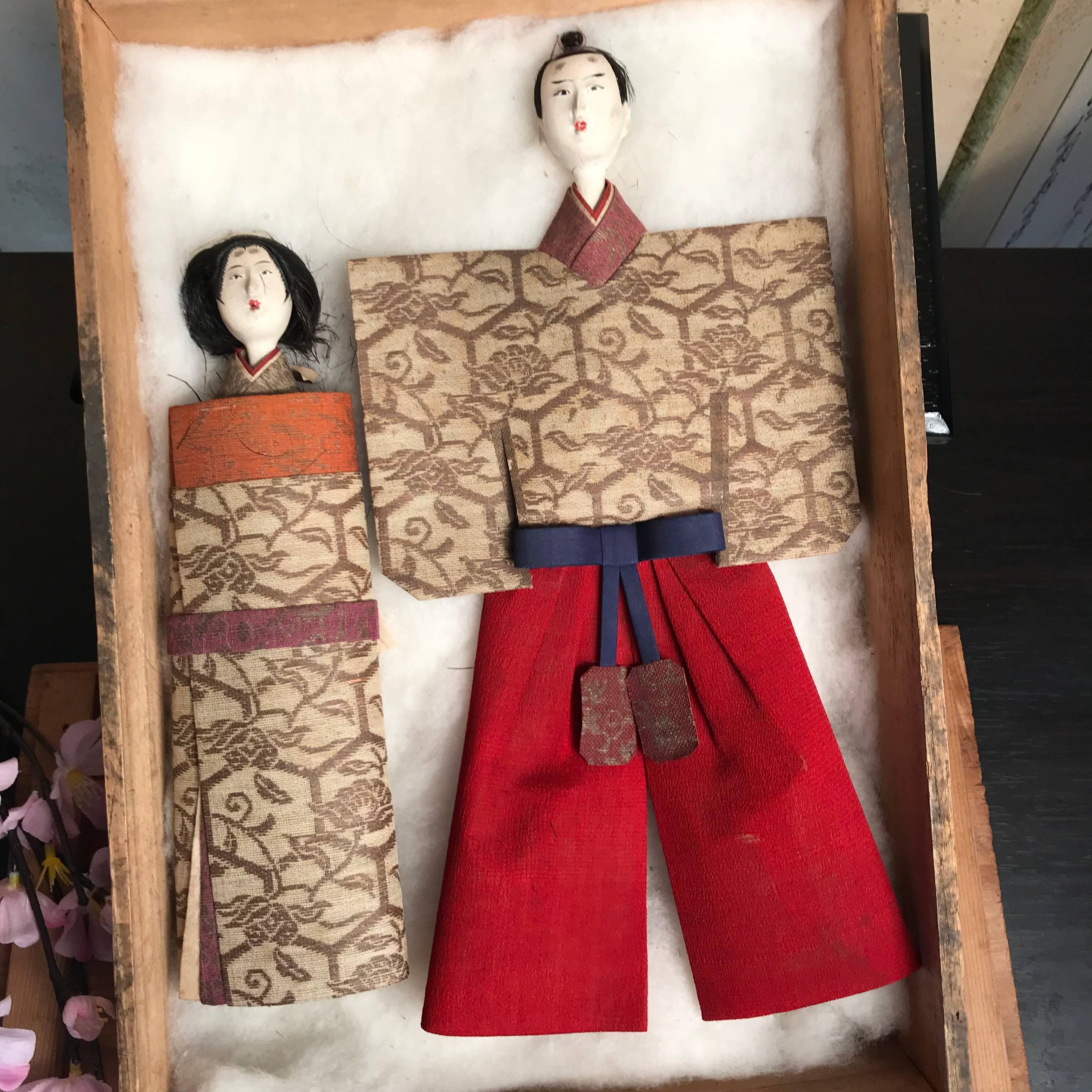 From our recent Japanese acquisitions 

A rare couple.

These Japanese Tachibina dolls represent the simplest essential form of the imperial couple. Their beautiful faces were crafted from crushed shell called gofun coated over carved wood and their
