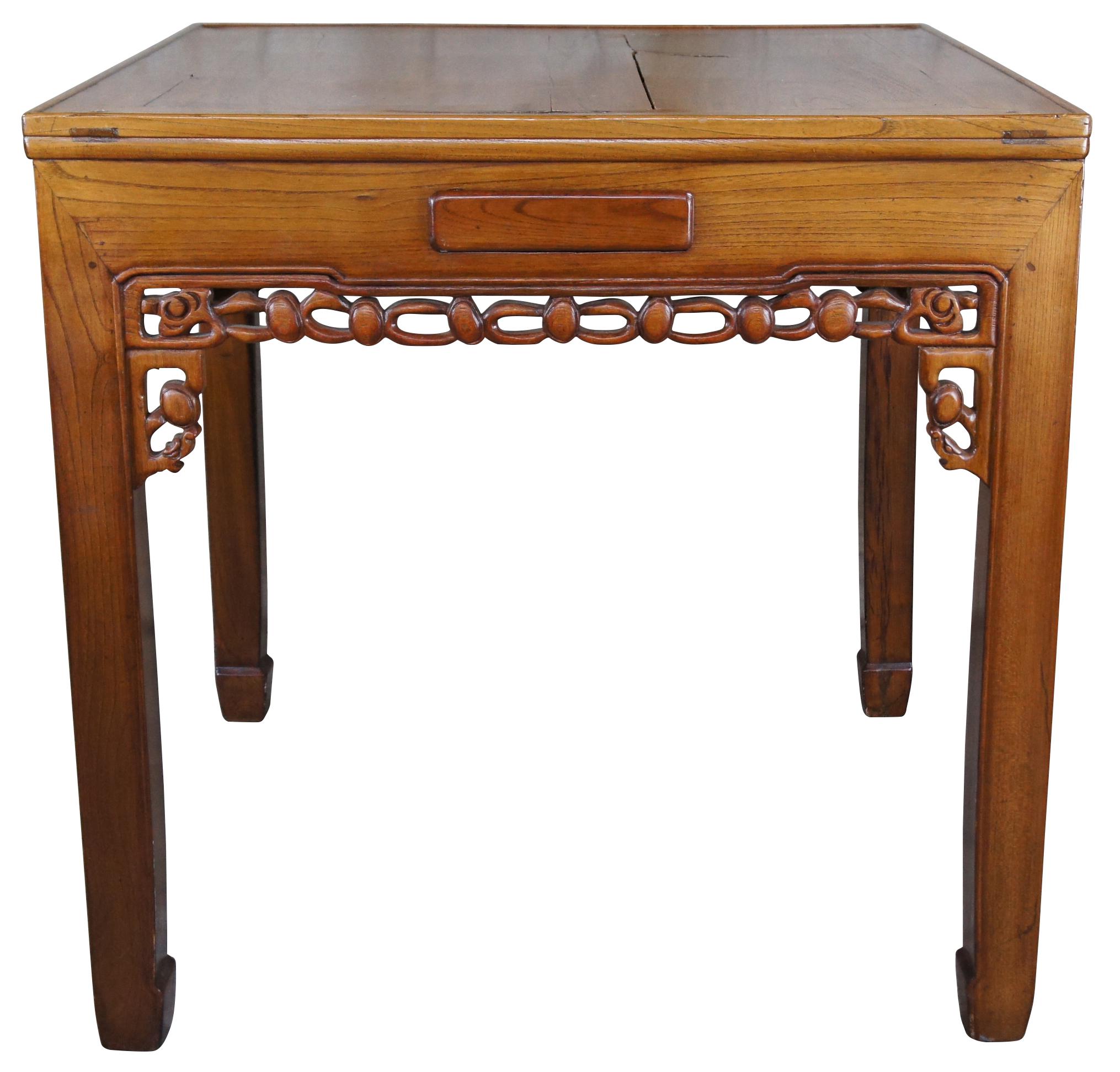 A beautiful Japanese solid elm Mahjong, game or card table. Purchased in Japan during the last quarter of the 20th century. Square form with carved and pierced apron. Features a dovetailed drawer along each side and a glass top. Built via Mortise
