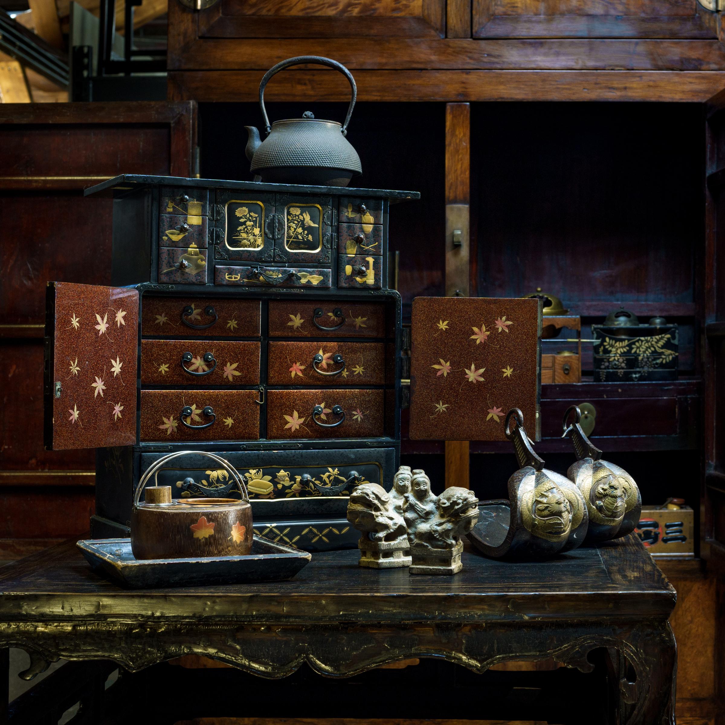 This wooden vessel is a Japanese tabako-bon, or 'tobacco tray,' used in tandem with a smoking pipe. Believed to have evolved from the traditional accessories of Japanese incense ceremony, tabako-bons first came into use in the 17th century and were