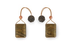 Japanese inro of the edo period adorned with a landscape houses near a lake