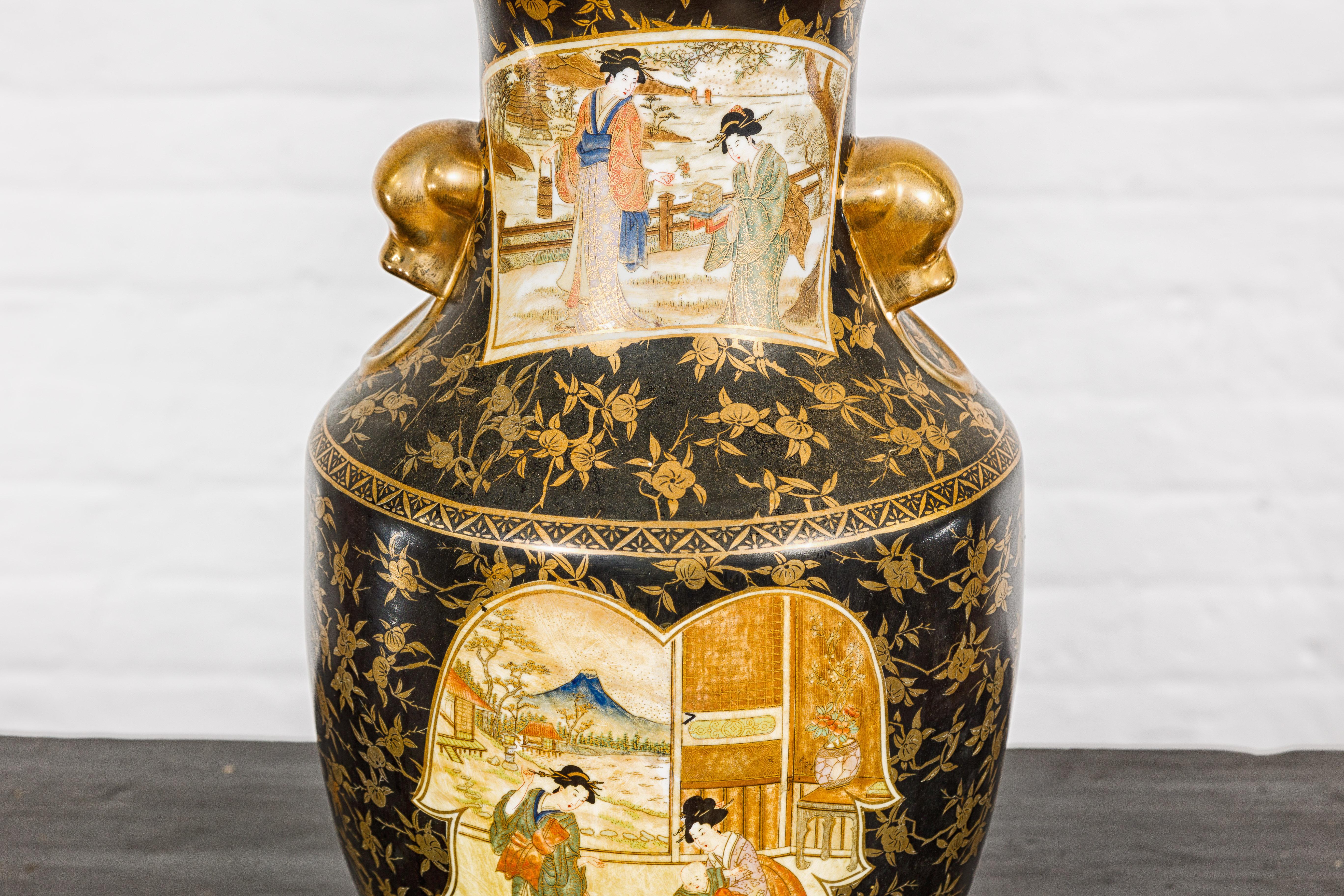 Gilt Japanese Inspired Black and Gold Vase with Family Scenes and Foo Dog Handles For Sale
