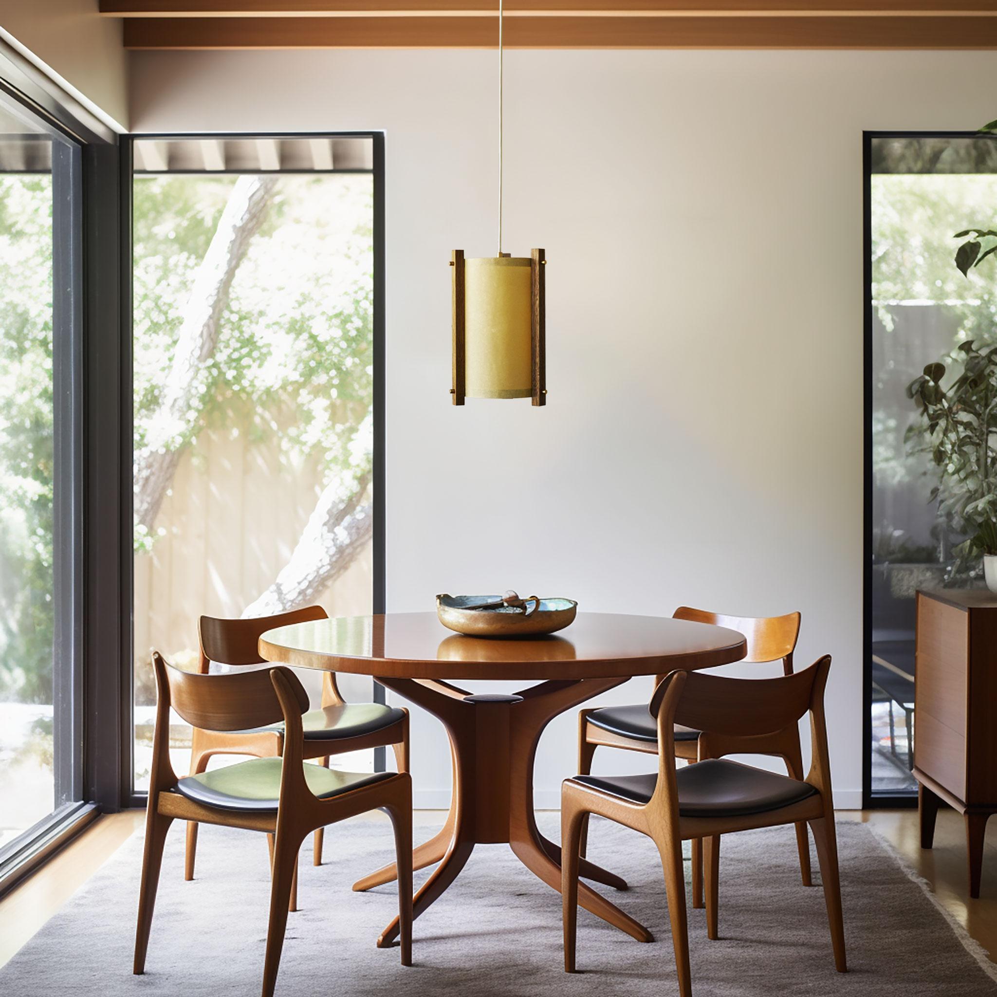 This simple, small modern design adds an element of sculpture to your room while the brass accents and paper shade brings a soft glow to any space. These pendants are equally beautiful off during the day as well as illuminated in the evening.

The